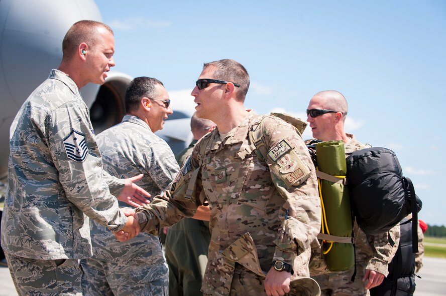 Senior leaders greet Airmen from the 41st Rescue Squadron, as they return from a deployment at Moody Air Force Base, Ga., June 10, 2014. During their deployment  the Airmen provided personal recovery and casualty evacuation for Bagram Airfield, Afghanistan.(U.S. Air Force photo by Airman 1st Class Ceaira Tinsley/Released)