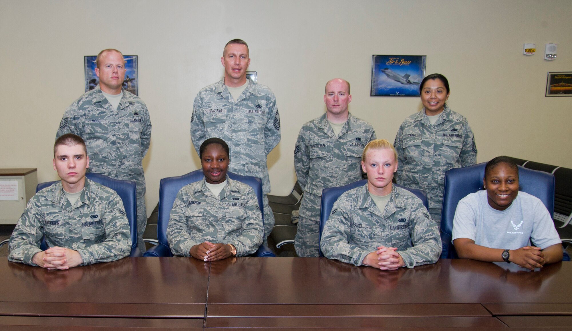 The 325th Logistics Readiness Squadron takes a group photo June 6. Top row from left to right: Tech. Sgt. Travis Moss, Senior Master Sgt. Frank Graziano, Staff Sgt. Michael Sprinsteen. Bottom row from left to right: Airman 1st Class Anton Nasedkin, Airman 1st Class Beatrice Atkinson, Airman 1st Class Megan Frei, Airman 1st Class Asia Bell. (U.S. Air Force photo by Airman 1st Class Sergio A. Gamboa)