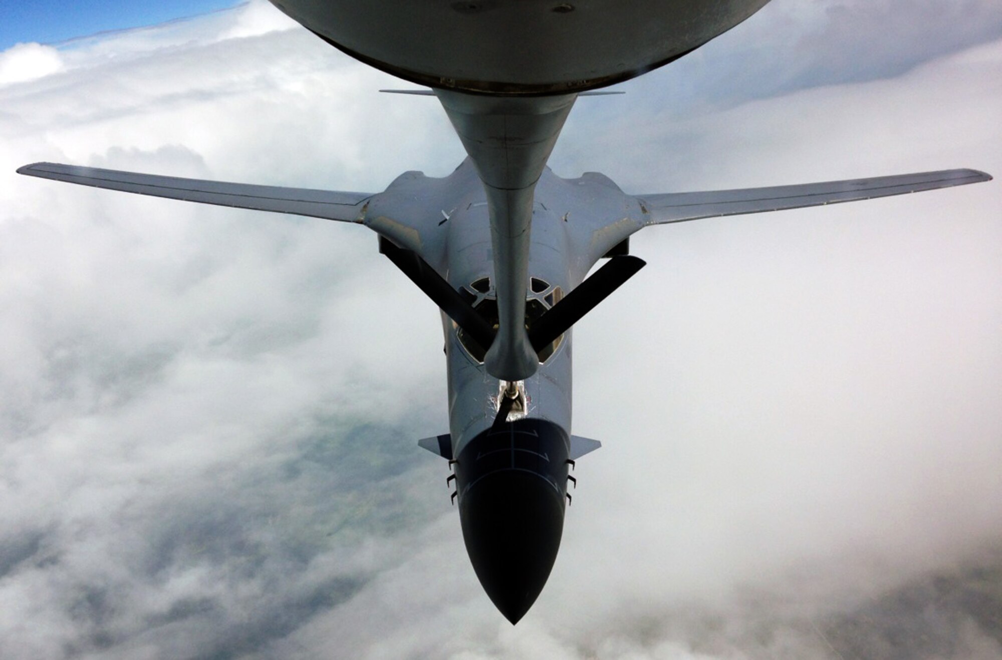 A B-1B Lancer assigned to Dyess Air Force Base, Texas, is refueled by a KC-135 Stratotanker assigned McConnell Air Force Base, Kan., during an air refueling training exercise, June 13, 2014. The KC-135 was operated by an air crew made up of members of the Air Force Reserve 931st Air Refueling Group. Aircrew members from the 931 ARG regularly perform air refueling training in order to practice air refueling techniques and maintain proficiency. Air refueling serves to extend presence, increase range and is a force multiplier for U.S. and allied nation aircraft, and is key to the global reach capabilities of the U.S. Air Force. (U.S. Air Force photo by Senior Master Sgt. Ray Lewis)