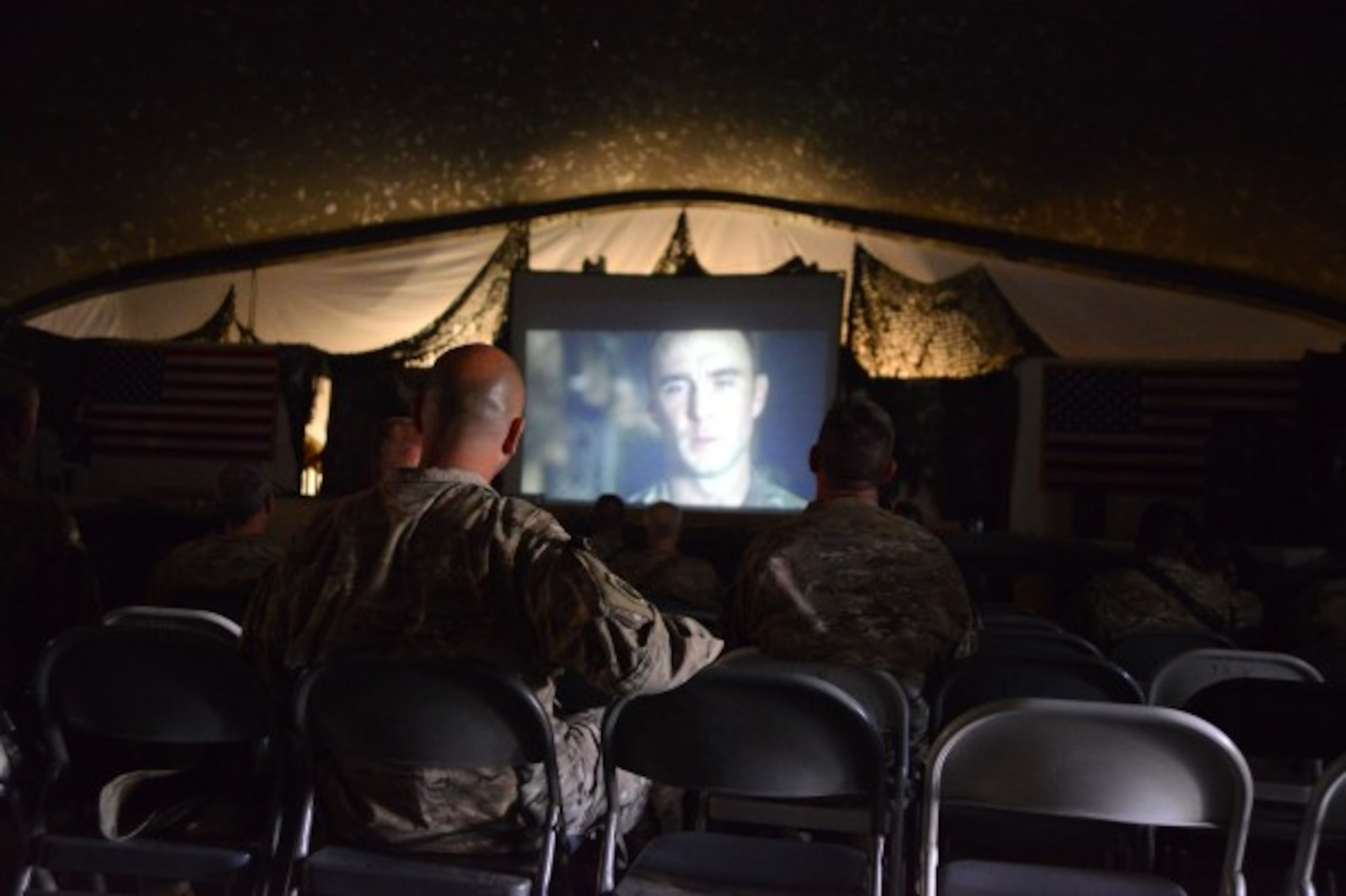 U.S. Soldiers and Airmen watch an early release of National Geographic’s Inside Combat Rescue: The Final Stand while at the Clamshell on Bagram Airfield, Afghanistan. (U.S. Air Force photo by Master Sgt. Cohen A. Young/Released)