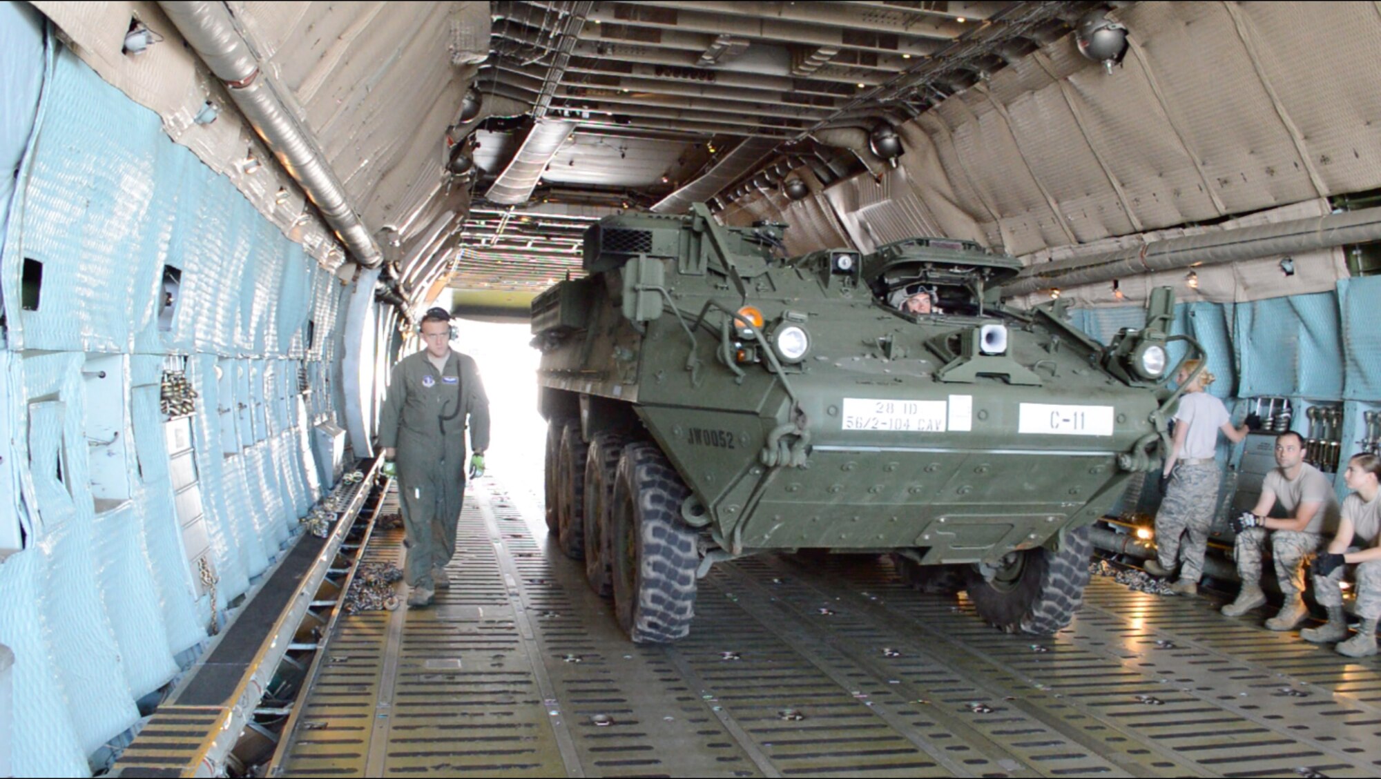 The first of four Stryker Combat Vehicles from the Pennsylvania National Guard drives aboard a West Virginia National Guard C-5 Galaxy at Harrisburg International Airport, Middletown, Pa., destined for Lithuania where PA soldiers and airmen will join other NATO countries participating in exercise Saber Strike 2014, June 5, 2014.  (U.S. Army National Guard photo/Maj. Edward Shank)


