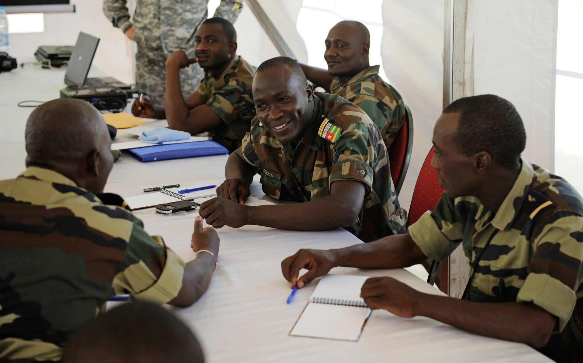 Airmen from neighboring countries speak about their military experience during African Partnership Flight in Dakar, Senegal June 16, 2014. U.S. Air Forces in Europe and Air Forces Africa Airmen are in Senegal for APF, a program designed to improve communication and interoperabilty between regional partners in Africa. The African partners include Senegal, Togo, Burkina Faso, Benin, Ghana, Mauritania, Nigeria and Niger with the U.S. helping with organization. (U.S. Air Force photo/ Staff Sgt. Ryan Crane)