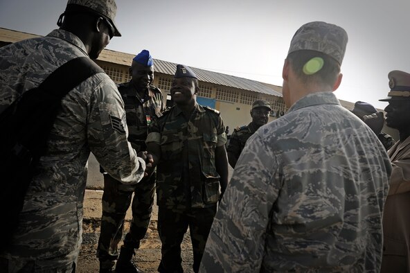 Staff Sgt. Mo Gadiaga, U.S. Air Forces in Europe and Air Forces Africa  cultural advisor, greets the team leads from each attending country during African Partnership Flight in Dakar, Senegal June 16, 2014. USAFE-AFAFRICA Airmen are in Senegal for APF, a program designed to improve communication and interoperabilty between regional partners in Africa. The African partners include Senegal, Togo, Burkina Faso, Benin, Ghana, Mauritania, Nigeria and Niger with the U.S. helping with organization. (U.S. Air Force photo/ Staff Sgt. Ryan Crane)