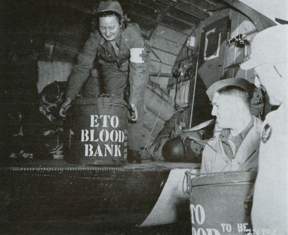"Whole blood for the First U.S. Army being loaded on evacuation aircraft returning to Normandy beachhead from the Membury airfield, Jun. 14 1944. (credit U.S. Army)
