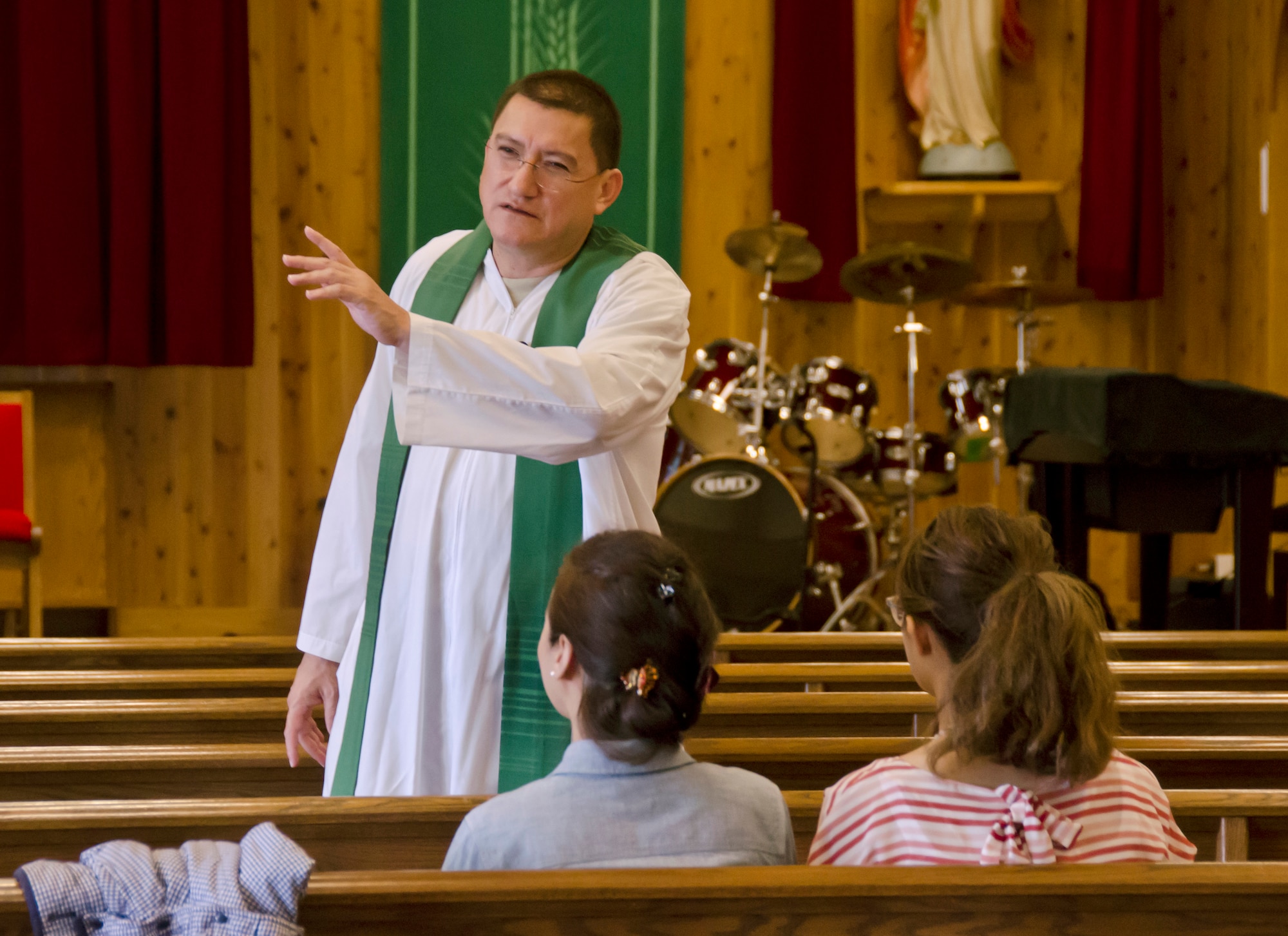 Capt. Carlos Bohorquez, a chaplain with the 126th Air Refueling Wing, conducts mass at the chapel on Naval Air Facility, Atsugi, Japan, June 12, 2014. The Illinois Air National Guard chaplain's office, from Scott Air Force Base, Ill., is providing assistance to offices at NAF Atsugi while gaining training experience. (Air National Guard photo by Senior Airman Laura Muehl)