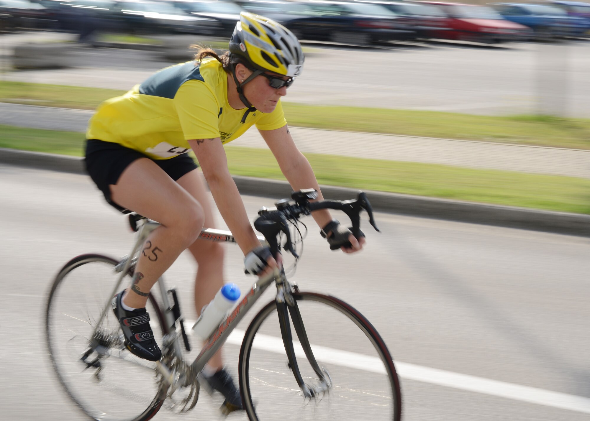 Jessica Sanchez, triathlon competitor, races through the course during the 16 kilometer biking segment of Aviano Sports Medicine Triathlon, June 14, 2014, at Aviano Air Base, Italy. Sanchez was the overall female winner with a time of 1:08:33. During the competition, participants swam 500 meters, biked 16 kilometers and ran a 5k. (U.S. Air Force photo/Tech. Sgt. Eric Donner)