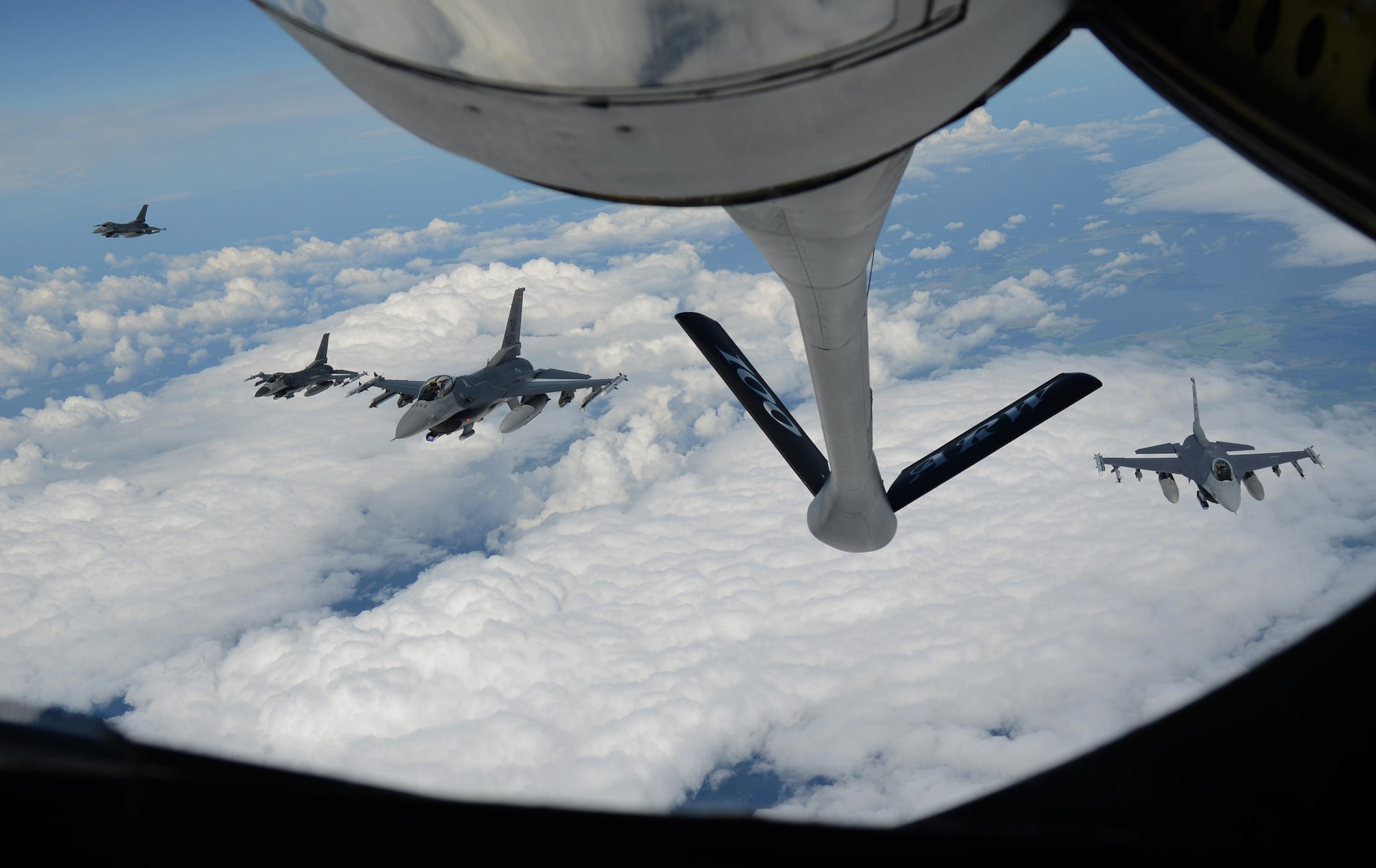 Four U.S. Air Force F-16 Fighting Falcons prepare to return to their Baltic Operations Exercise mission after receiving fuel from a KC-135 Stratotanker June 13, 2014, over Germany. The BALTOPS Exercise provides the opportunity for personnel of participating nations to engage in realistic training to build experience, teamwork and strengthen interoperability while working toward mutual goals. (U.S. Air Force photo/Airman 1st Class Kyla Gifford/Released)