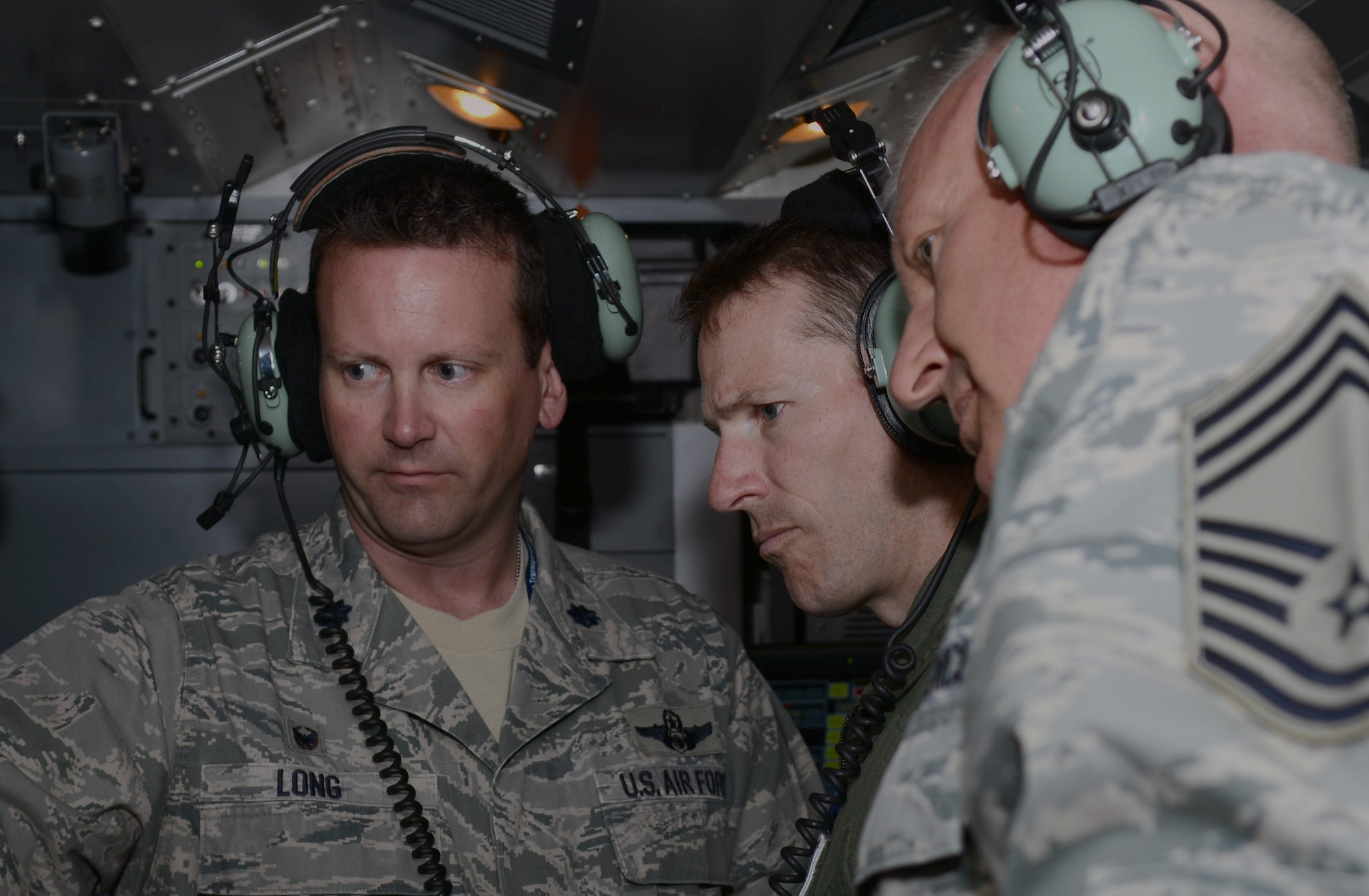 U.S. Air Force Lt. Col. Robert Long, left, 606th Expeditionary Air Control Squadron commander from Fort Worth, Texas, shows his unit’s operations to U.S. Air Force Lt. Col. Steven Horton, center, 52nd Air Expeditionary Group commander from Sunrise Beach, Texas, and U.S. Air Force Chief Master Sgt. Bruce Zahn, 52nd Expeditionary Operations Group superintendent from Westhope, N.D., June 12, 2014, at Powidz Air Base, Poland. The 606th EACS is primarily supporting EAGLE TALON, a Polish national air exercise, to increase interoperability with air-to-air and air-to-surface training involving Polish, U.S., French, British and NATO aircraft. (U.S. Air Force photo/Airman 1st Class Kyla Gifford/Released)
