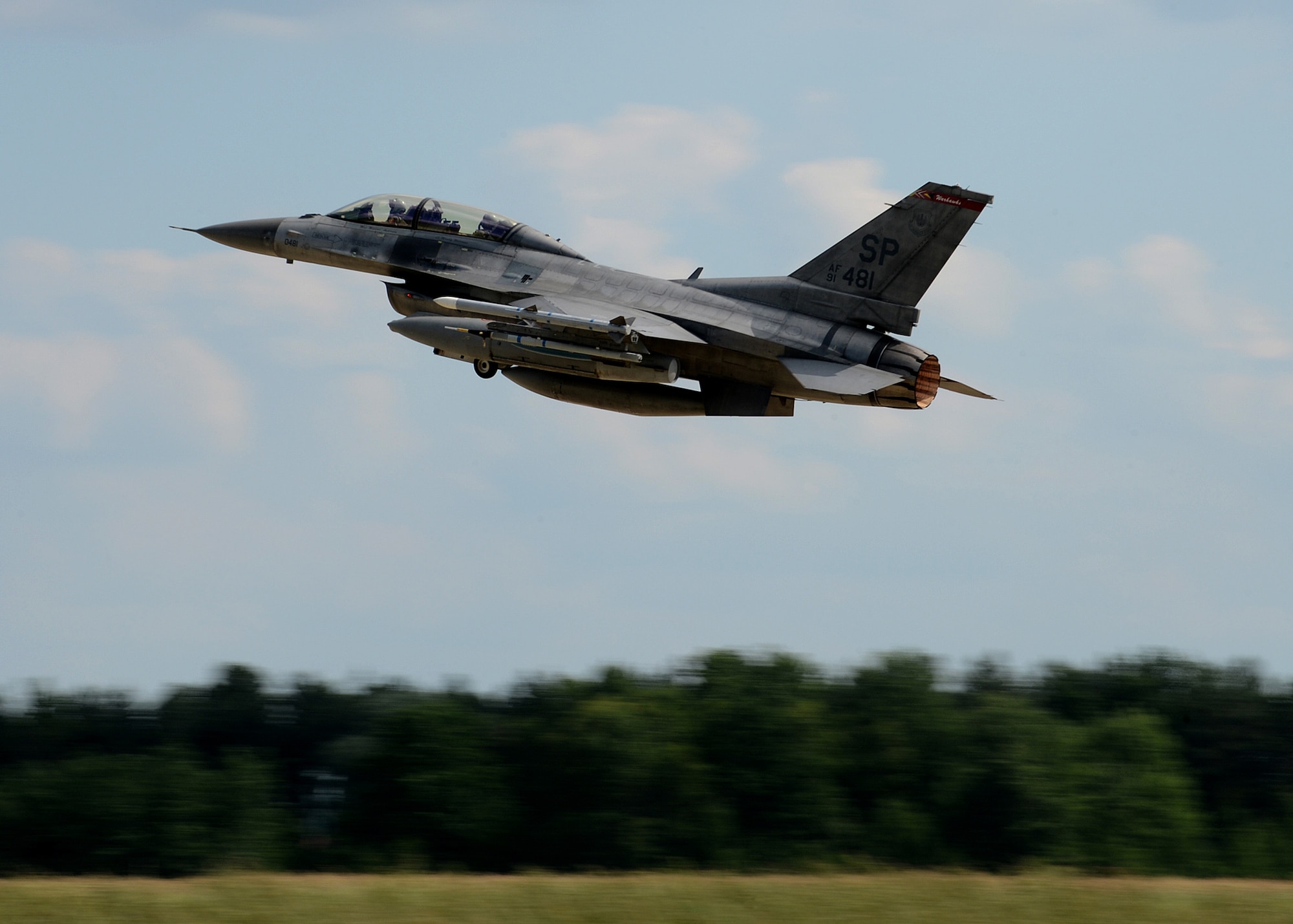 A U.S. Air Force F-16 Fighting Falcon fighter aircraft from the 52nd Fighter Wing, Spangdahlem Air Base, Germany, takes off from Lask Air Base, Poland, June 12, 2014. There are 18 aircraft participating in multinational Polish-led Exercise EAGLE TALON and U.S. Navy-led BALTOPS 14 in addition to U.S. Aviation Detachment Rotation 14-3. U.S. Air Force pilots flew with other pilots from multiple countries to increase readiness for real-world operations and enhance interoperability between NATO forces. (U.S. Air Force photo by Airman 1st Class Kyle Gese/Released)