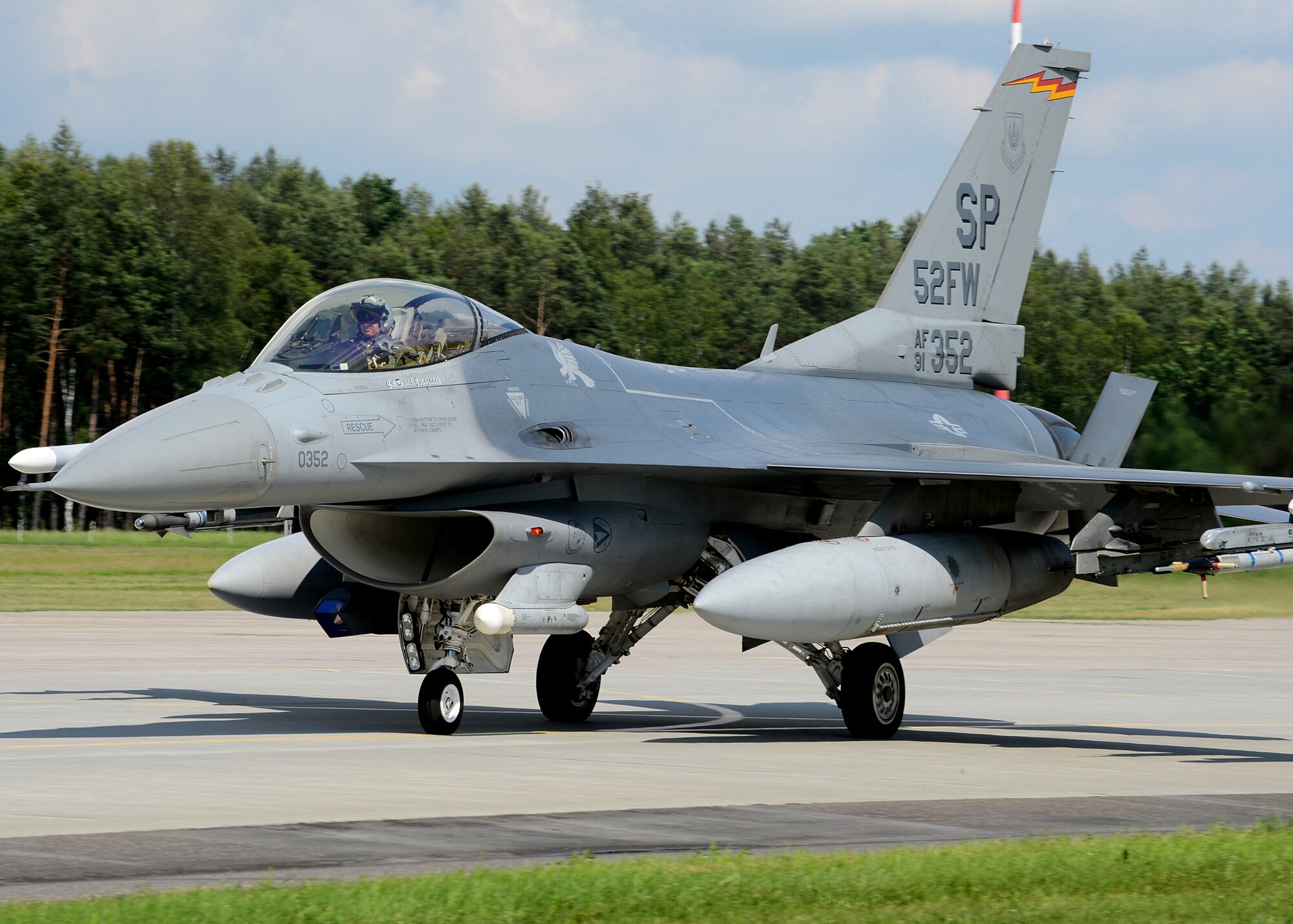 A U.S. Air Force F-16 Fighting Falcon fighter aircraft from the 52nd Fighter Wing, Spangdahlem Air Base, Germany, taxies at Lask Air Base, Poland, June 12, 2014. There are 18 aircraft participating in multinational Polish-led Exercise EAGLE TALON and U.S. Navy-led BALTOPS 14 in addition to U.S. Aviation Detachment Rotation 14-3. U.S. Air Force pilots flew with other pilots from multiple countries to increase readiness for real-world operations and enhance interoperability between NATO forces. (U.S. Air Force photo by Airman 1st Class Kyle Gese/Released)