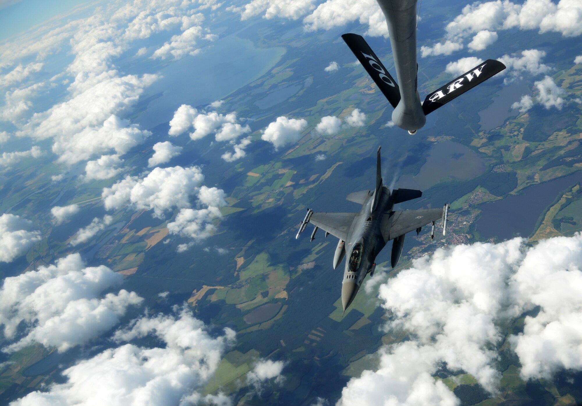 A U.S. Air Force F-16 C/D Fighting Falcon separates from a KC-135 Stratotanker assigned to the 100th Air Refueling Wing after taking on fuel during the Baltic Operations Exercise June 12, 2014, over Germany. Celebrating its 42nd year, the BALTOPS Exercise aims to improve security in the Baltic Sea through cooperation among regional allies. (U.S. Air Force photo/Airman 1st Class Dillon Johnston/Released)