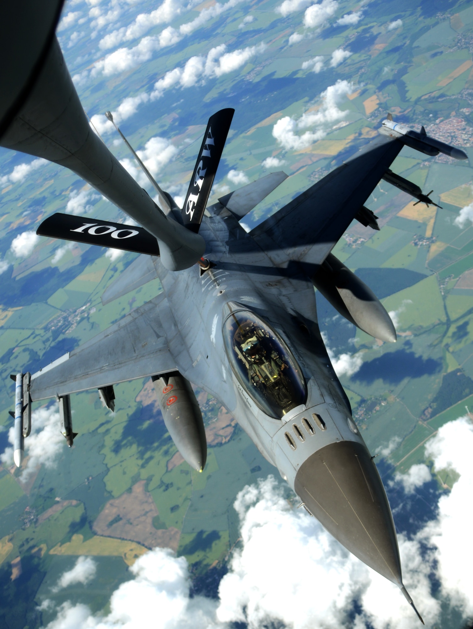 A KC-135 Stratotanker assigned to the 100th Air Refueling Wing refuels a U.S. Air Force F-16 C/D Fighting Falcon during the Baltic Operations Exercise June 12, 2014, over Germany. This exercise provides the opportunity for Airmen of participating nations to engage in realistic training to build experience, teamwork and strengthen interoperability while working toward mutual goals. (U.S. Air Force photo/Airman 1st Class Dillon Johnston/Released)