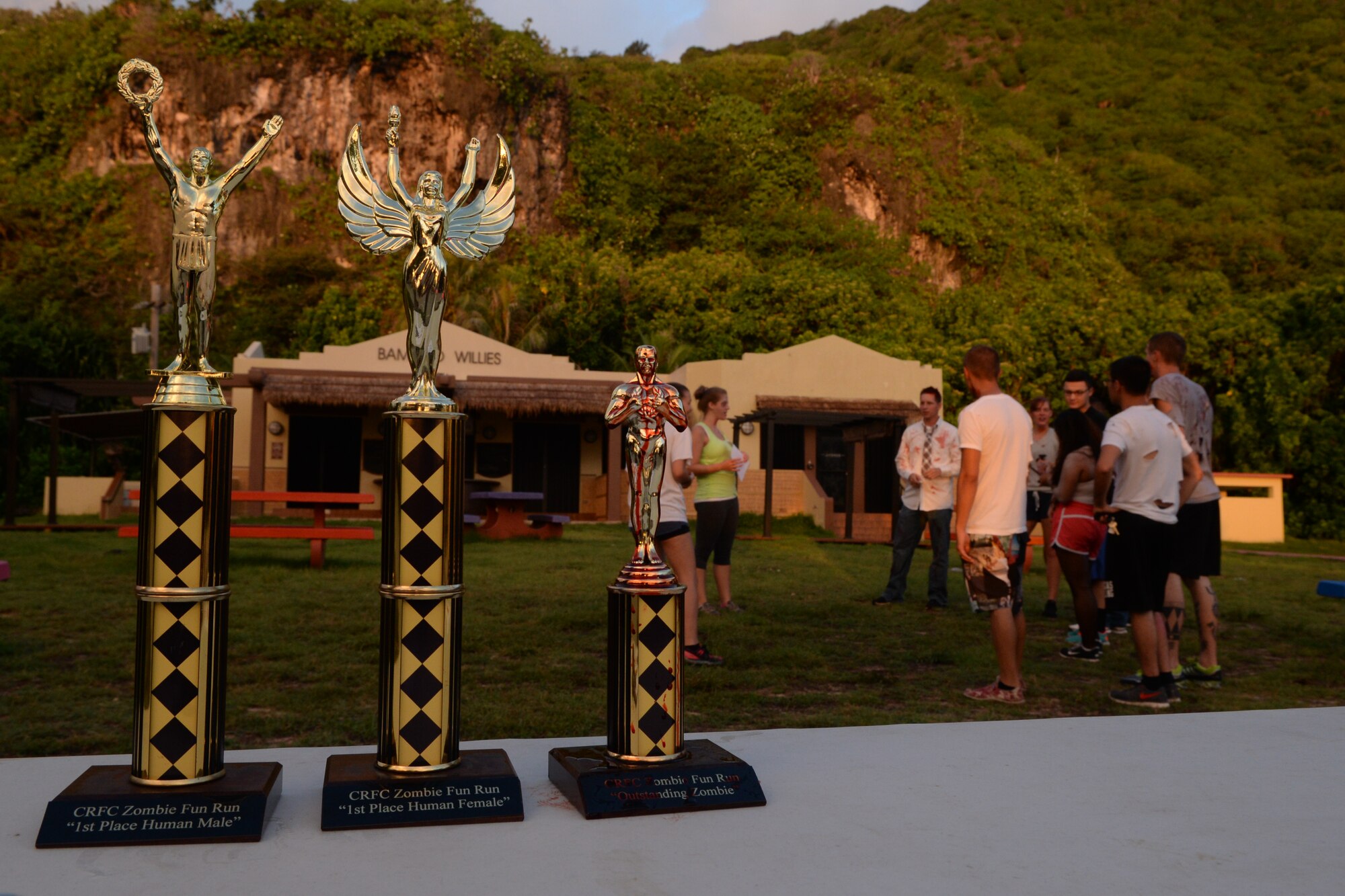 The 36th Force Support Squadron hosted a Zombie 5K Fun Run June 11, 2014, at Tarague Beach on Andersen Air Force Base, Guam. The first male and female that finished first received a trophy and the “zombie” who captured the most “lives” represented by flags worn on each runner’s belt won a trophy. (U.S. Air Force photo by Airman 1st Class Amanda Morris/Released) 