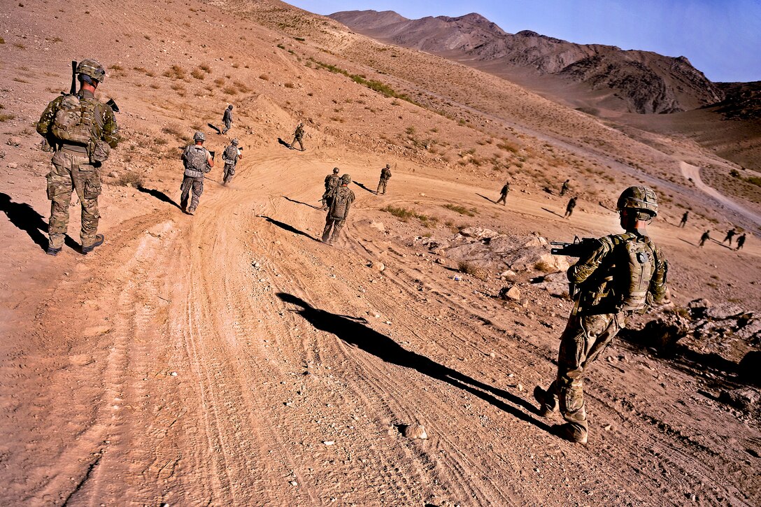 U.S. soldiers patrol to a village in the district of Mizan, Afghanistan, Oct. 17, 2011. The soldiers are assigned to the Provincial Reconstruction Team Zabul, Agribusiness Development Team, and 489th Civil Affairs Battalion. The team's mission is to conduct civil-military operations in Zabul province to extend the reach and legitimacy of the Afghan government. 
