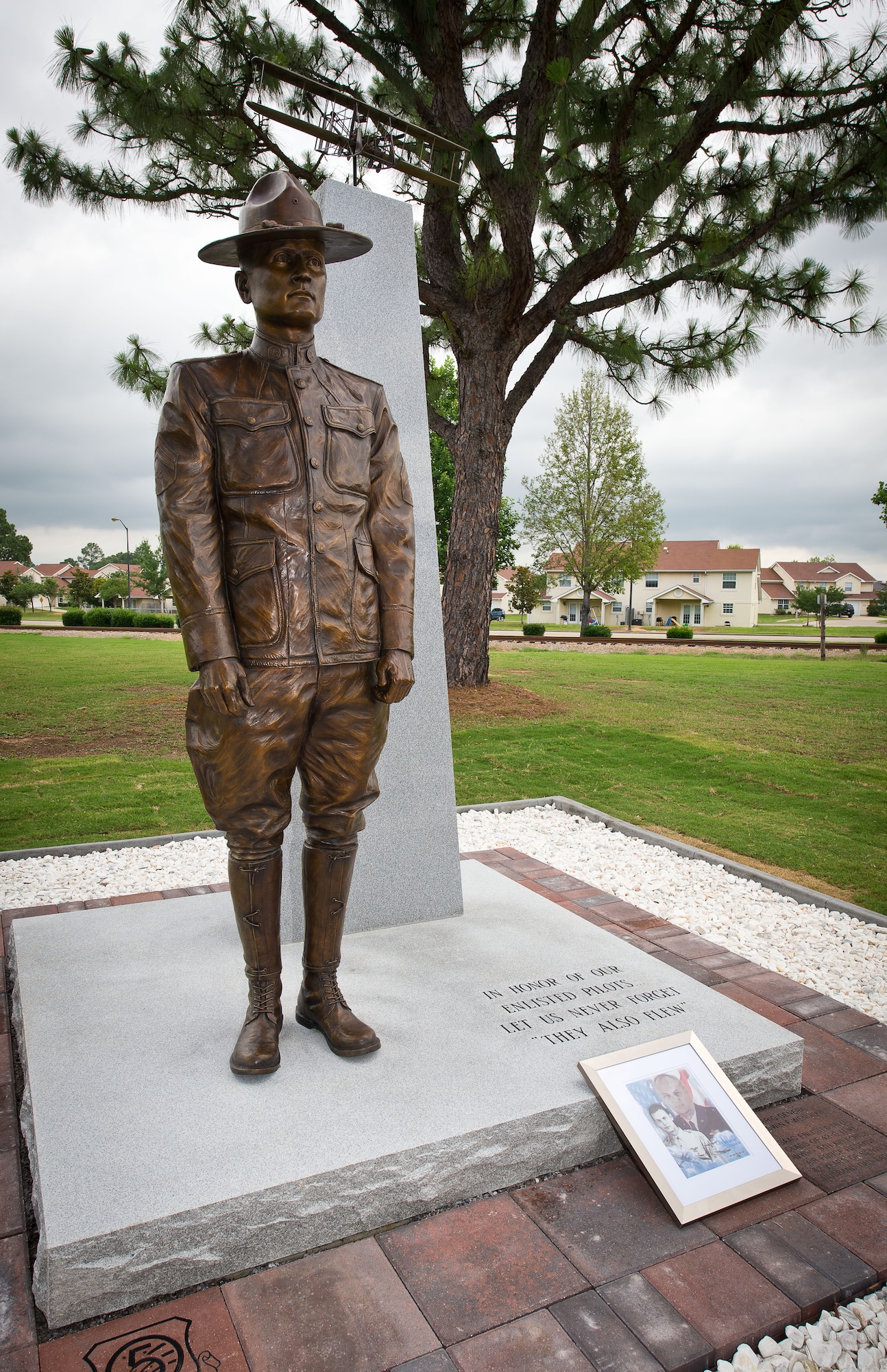 A new monument honoring the nearly 3,000 enlisted sergeant pilots who served from 1912-1957 was unveiled during a ceromony June 9, 2014, at the Enlisted Heritage Hall at Maxwell-Gunter Air Force Base. The monument depicts Cpl. Vernon L. Burge, the first enlisted pilot in military aviation, and recognizes the acomplishments of the enlisted fliers who came after him. (U.S. Air Force photo by Donna Burnett)