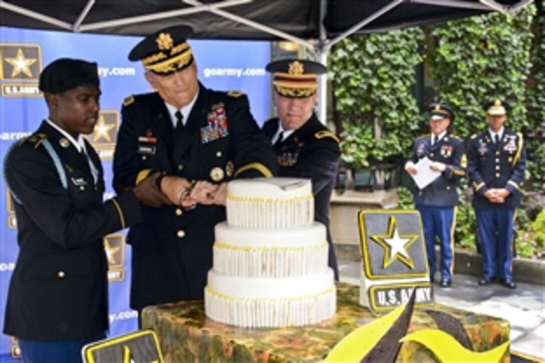 Army Chief of Staff Gen. Ray Odierno, center, cuts into the Army's 239th birthday cake with Army Col. Thomas Palmatier, a 37-year veteran, and Army Pvt. Naiquan Walker in Bryant Park, N.Y., June 13, 2014. Traditionally, senior leaders cut into the cake with one the Army's longest-serving soldiers and one of its newest. Walker is assigned to the 69th Infantry Regiment, New York Army National Guard.