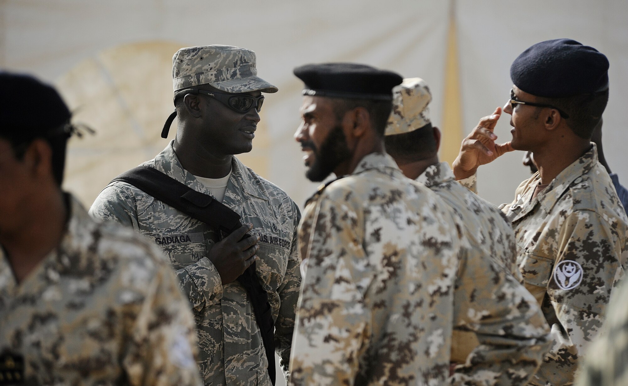 Staff Sgt. Mo Gadiaga,U.S. Air Forces in Europe and Air Forces Africa cultural adviser, speaks with airmen from the Mauritanian air force during African Partnership Flight in Dakar, Senegal, June 16, 2014. USAFE-AFAFRICA Airmen are in Senegal for APF, a program designed to improve communication and interoperabilty between regional partners in Africa. The African partners include Senegal, Togo, Burkina Faso, Benin, Ghana, Mauritania, Nigeria and Niger with the U.S. helping with organization. (U.S. Air Force photo/ Staff Sgt. Ryan Crane)