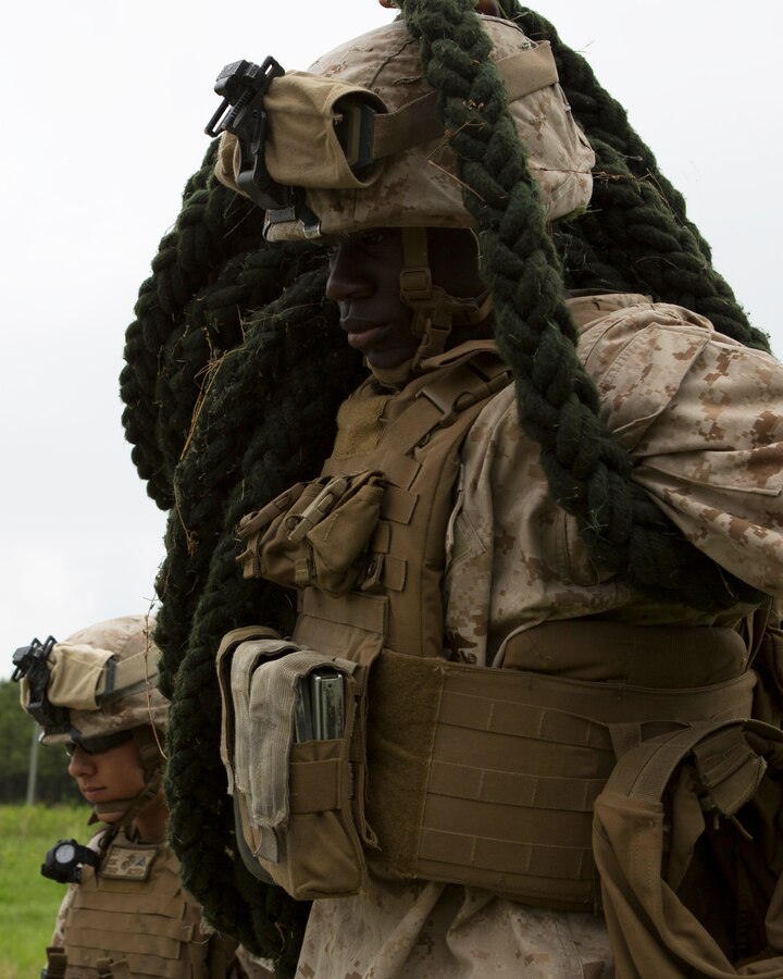 U.S. Marine Corps Lance Cpl. Tyshawn Davis a machine gunner with Fox Company, 2nd Battalion, 2nd Marines, carries the rope to be used for fast rope training aboard Camp Lejeune, N.C., June 9, 2014. The training allowed Marines to apply proper techniques and procedures. (U.S. Marine Corps photo by Lance Cpl. Andre Dakis, 26th MEU Combat Camera/Released)