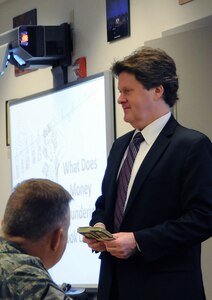 Steve Gurdak, detective with the Washington D.C./Baltimore High Intensity Drug Trafficking Area, discusses the nuances of money laundering during the Counter Threat Finance course on Bolling Air Force Base, Dec. 9, 2011. National Guard Counterdrug personnel spent two weeks in the classroom training for the new Counter Threat Finance mission of the National Guard's Counterdrug program