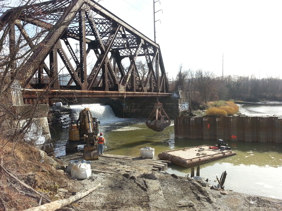 Construction of the cofferdam at Omega Pond as part of the Ten Mile River Ecosystem Restoration project, East Providence, R.I. Construction of the fish ladder at Omega Pond in ongoing and is expected to be complete in April of 2015.