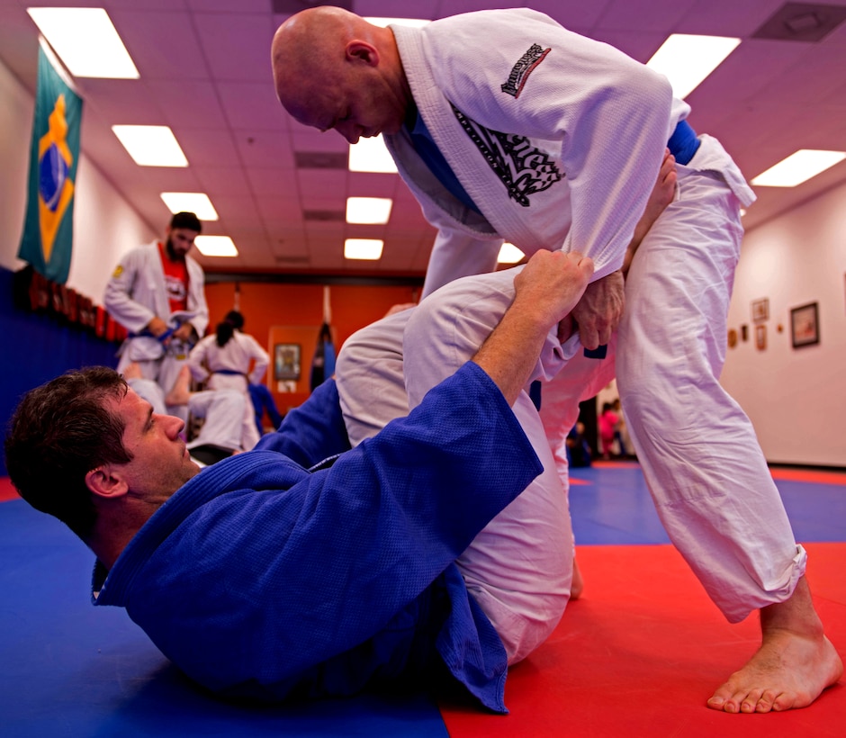 Two Brazilian jujitsu students spar at the KOA martial arts school in Stafford, Va., June 3, 2014. Kelly Grissom, owner and coach of KOA, co-founded the Lion Heart Initiative, a plan to teach mixed martial arts to young urban youth of Senegal, West Africa, and create better opportunities for them.