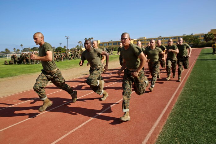 Recruits of Hotel Company, 2nd Recruit Training Battalion, begin their 880-yard run during the Combat Fitness Test at Marine Corps Recruit Depot San Diego, June 11. The recruits were told the requirements and techniques for each section of the CFT before they started the test. 