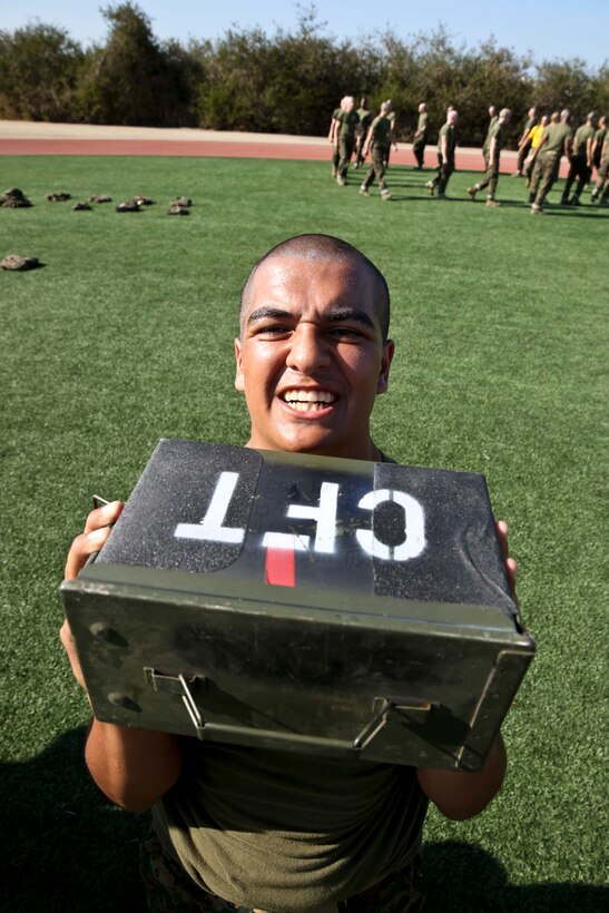 Recruit Josue Torres, Platoon 2167, Hotel Company, 2nd Recruit Training Battalion, conducts ammunition-can lifts during the Combat Fitness Test at Marine Corps Recruit Depot San Diego, June 11. This was the recruits’ first attempt at the CFT.