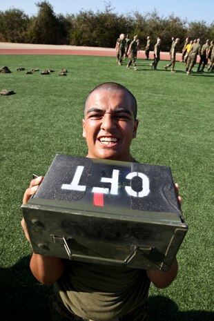 Recruit Josue Torres, Platoon 2167, Hotel Company, 2nd Recruit Training Battalion, conducts ammunition-can lifts during the Combat Fitness Test at Marine Corps Recruit Depot San Diego, June 11. This was the recruits’ first attempt at the CFT.