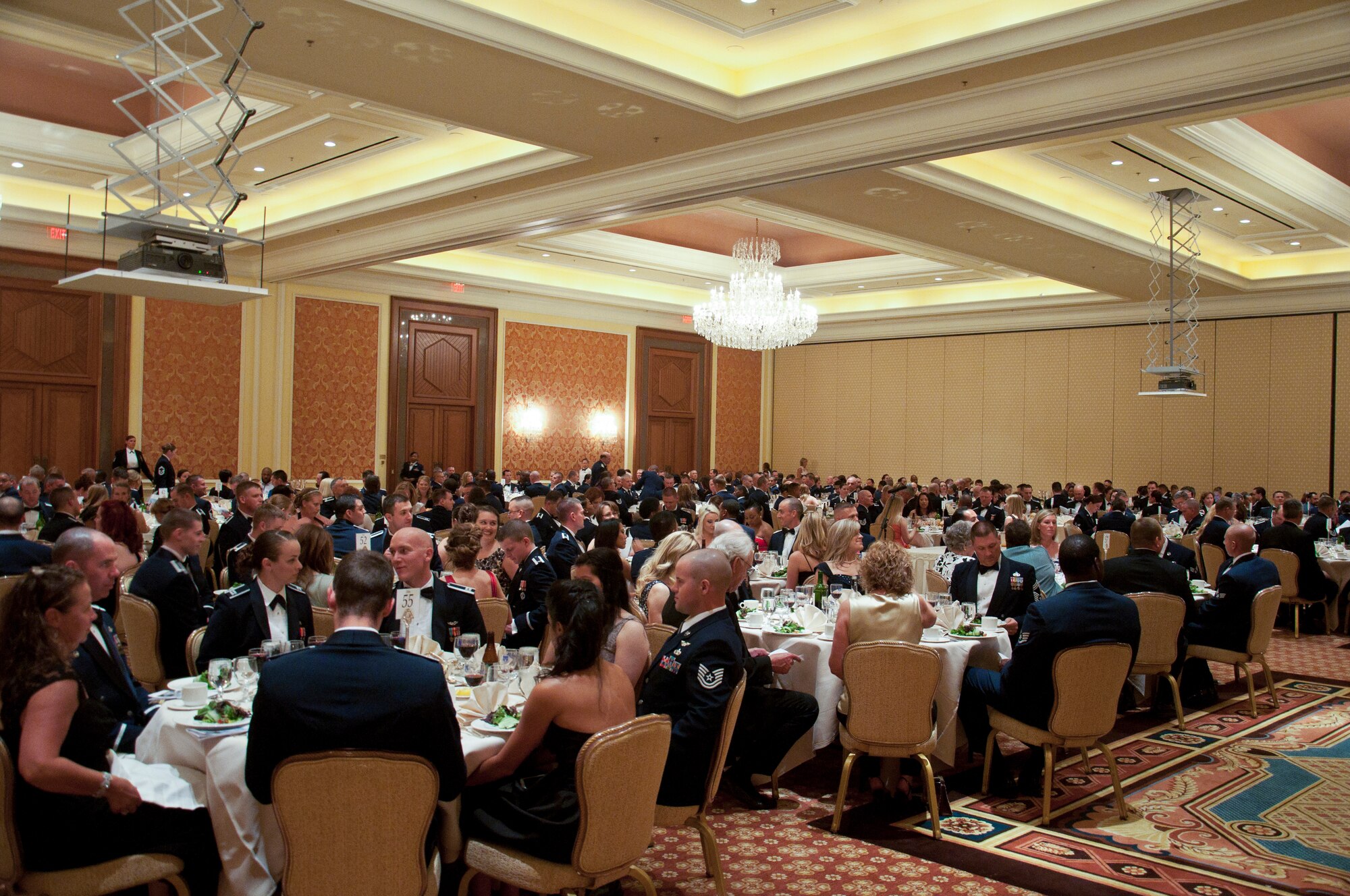 Ninetieth Missile Wing personnel and their loved ones attend the 90th Missile Wing Dining Out June 13, 2014, in the Little America Hotel & Resort in Cheyenne, Wyo. The event was the wing's first dining out in four years. (U.S. Air Force photo by Airman 1st Class Jason Wiese)