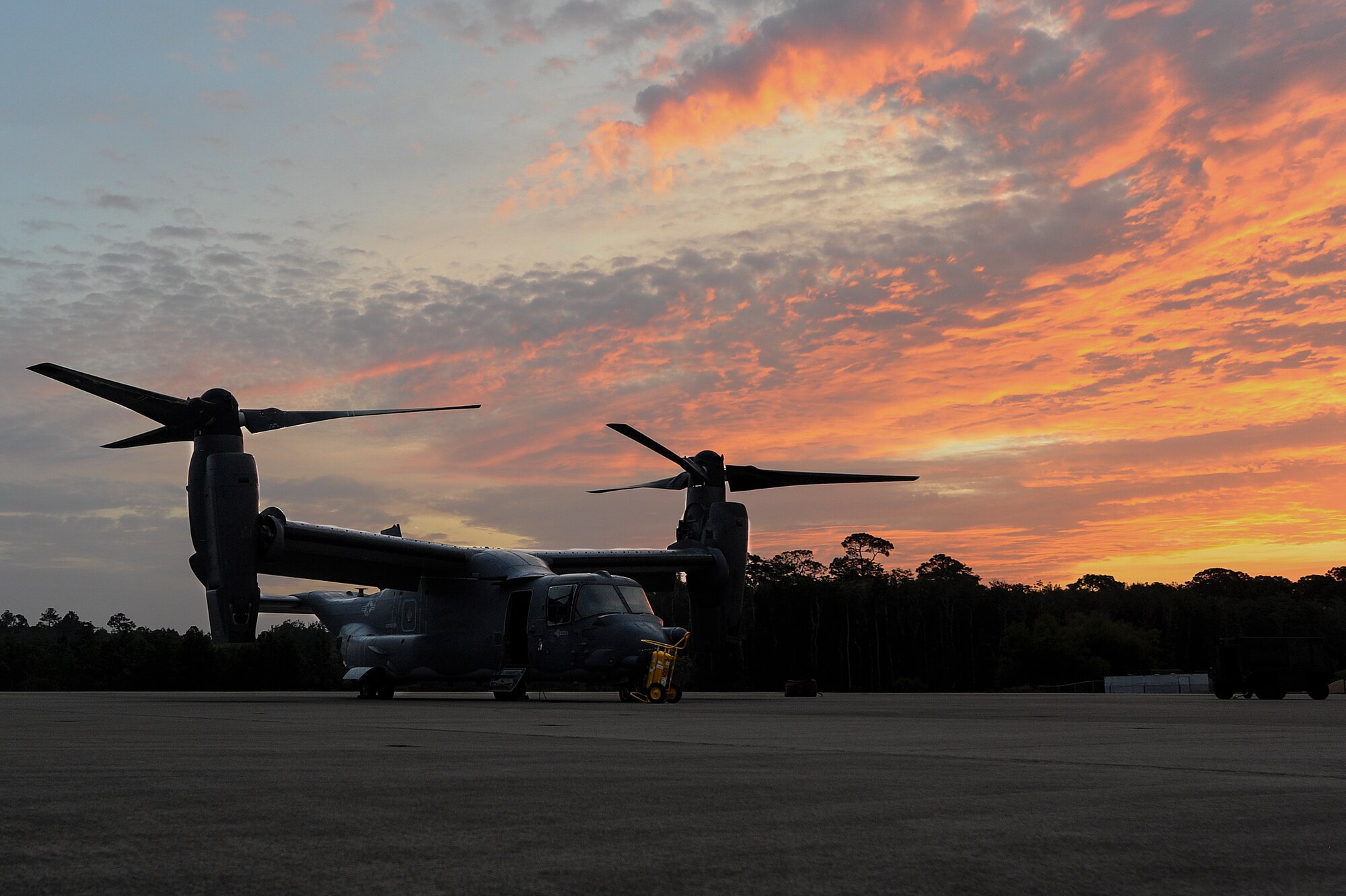 A CV-22 Osprey sits on the flightline at Hurlburt Field, Fla., June 13, 2014. The Osprey can conduct long-range infiltration, exfiltration and resupply missions for special operations forces. (U.S. Air Force photo/Airman 1st Class Jeff Parkinson)









