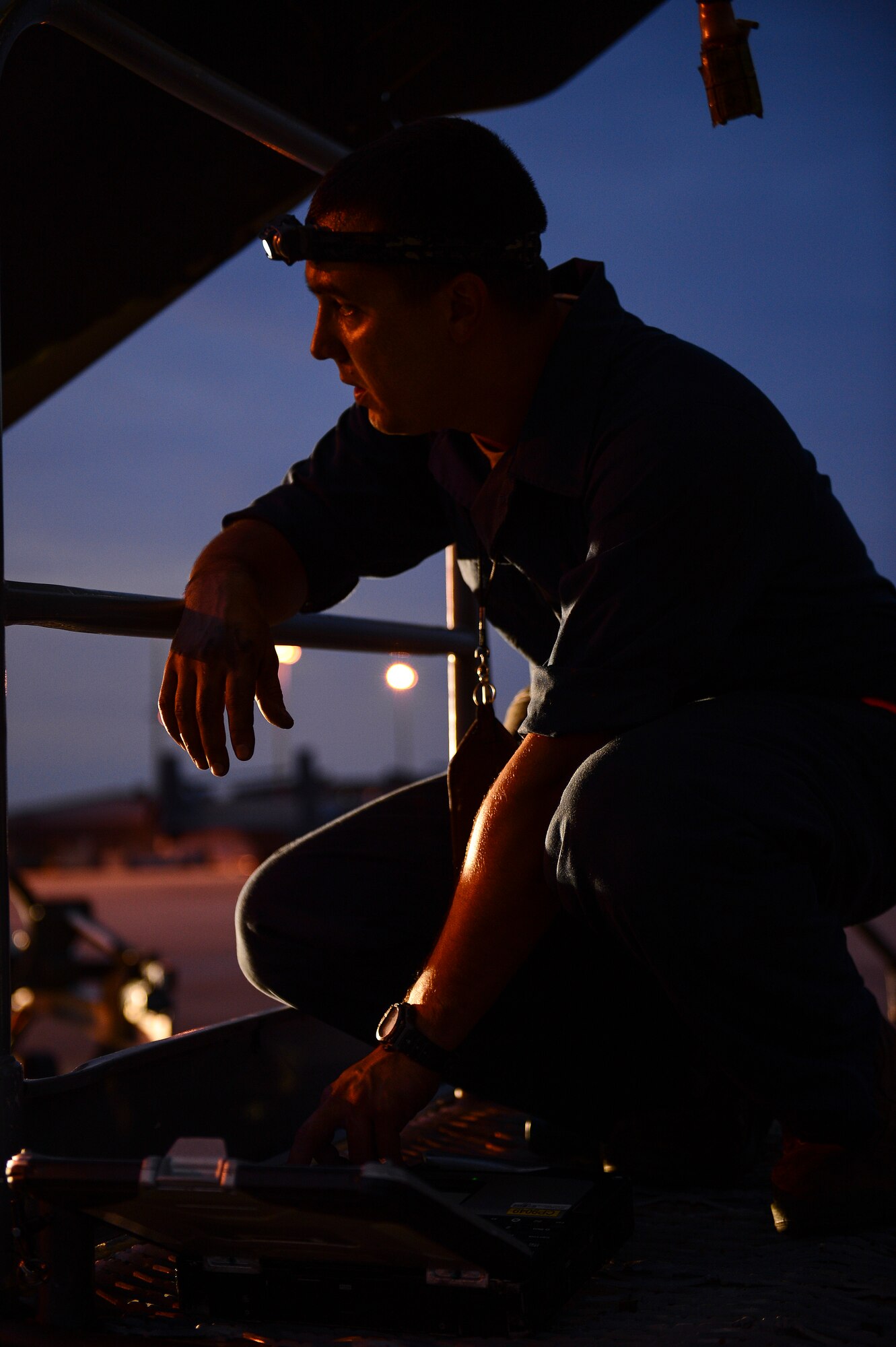Senior Airman Chris Abadia, 801st Special Operations Aircraft Maintenance Squadron dedicated crew chief, reviews his CV-22 Osprey maintenance task list on Hurlburt Field, Fla., June 13, 2014. (U.S. Air Force photo/Airman 1st Class Jeff Parkinson)





