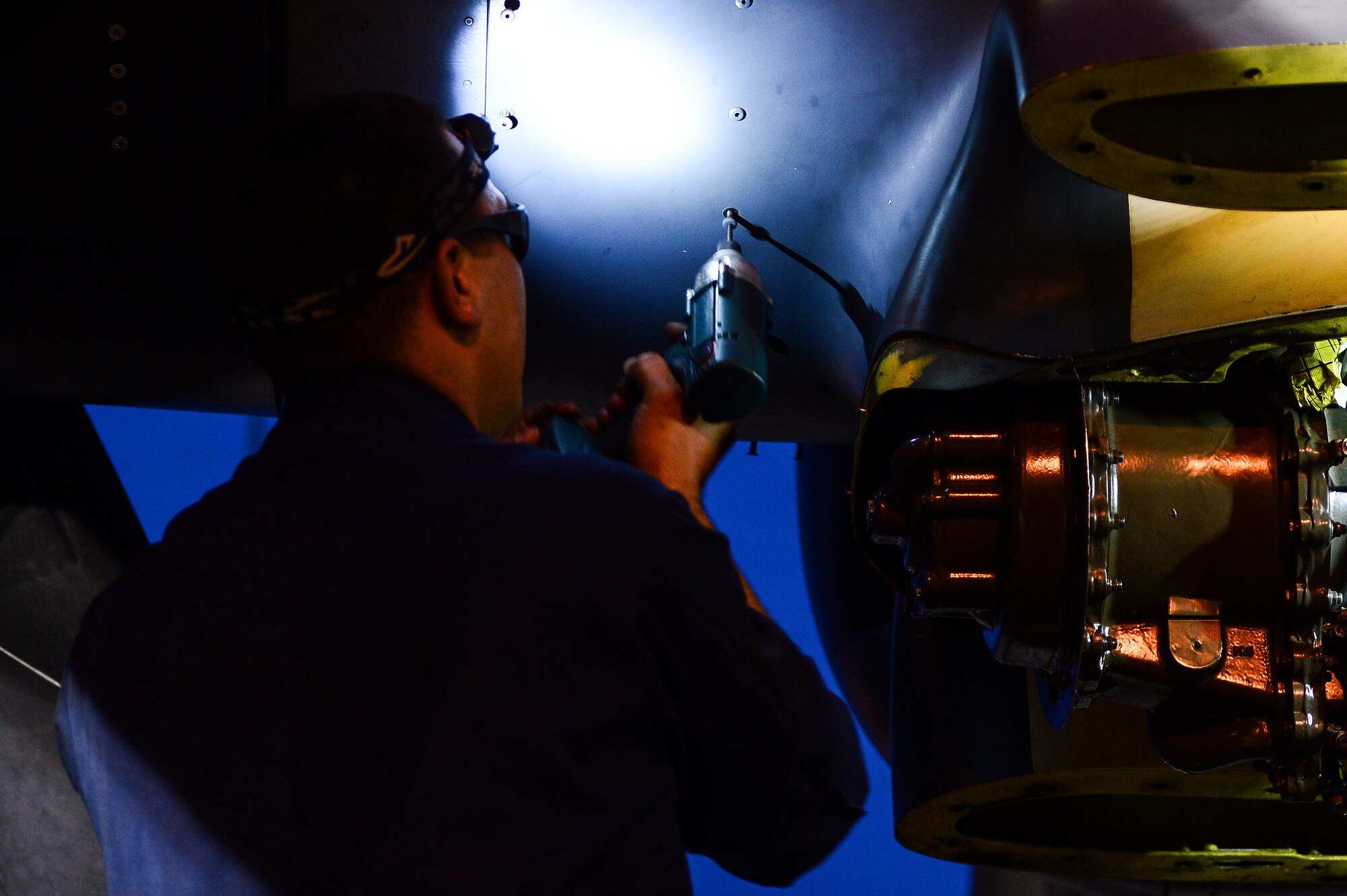 Staff Sgt. Perry Otillio, 801st Special Operations Aircraft Maintenance Squadron dedicated crew chief, removes screws from a CV-22 Opsrey engine on Hurlburt Field, Fla., June 13, 2014. The Osprey can conduct long-range infiltration, exfiltration and resupply missions for special operations forces. (U.S. Air Force photo/Airman 1st Class Jeff Parkinson)


