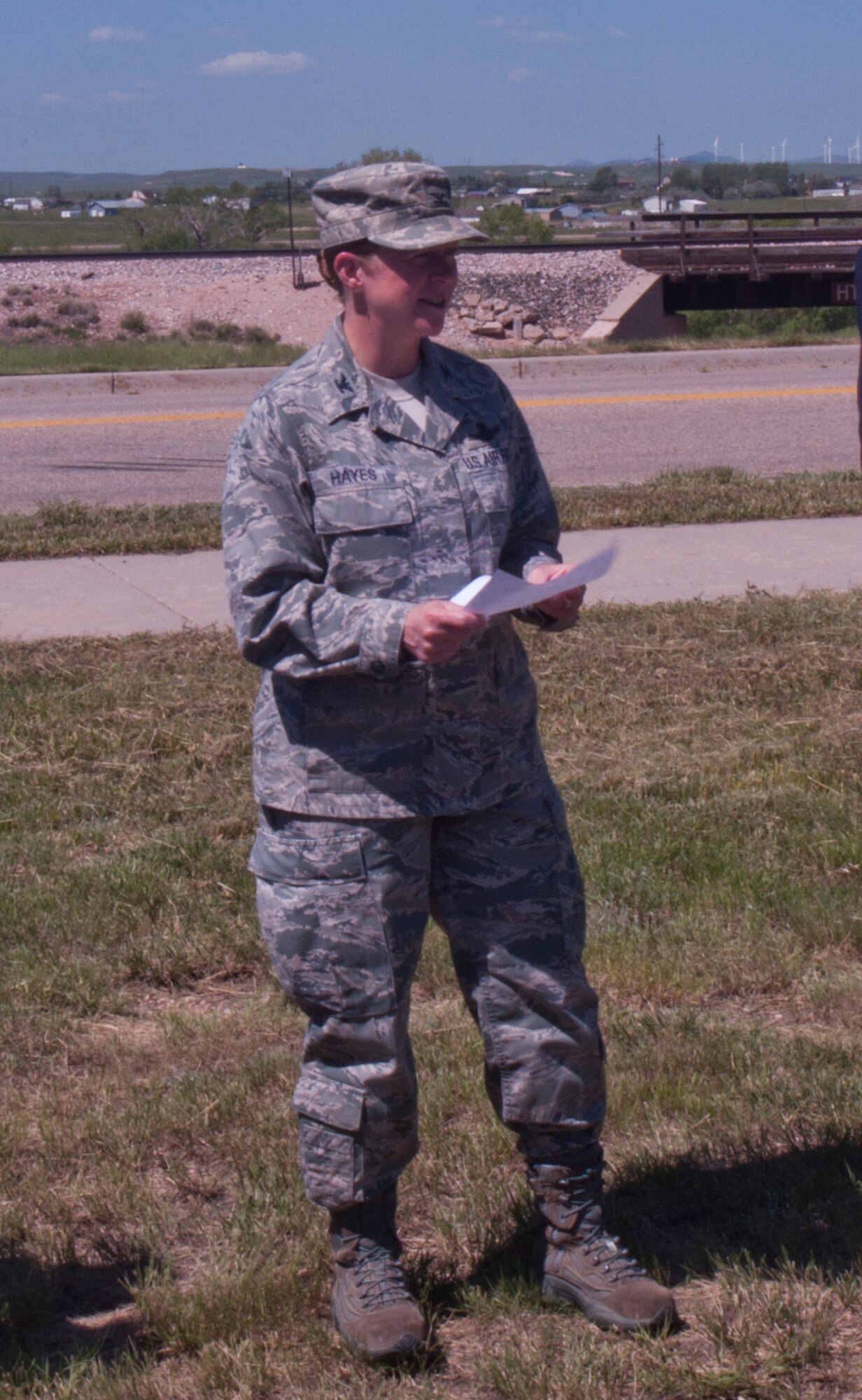 Col. Tracey Hayes, 90th Missile Wing commander, reads a proclamation near Atlas West housing June 13, 2014, explaining the importance of trees and F.E. Warren's dedication to caring for them. This satisfied a requirement necessary to be named Tree City, USA. (U.S. Air Force photo by Airman 1st Class Jason Wiese)