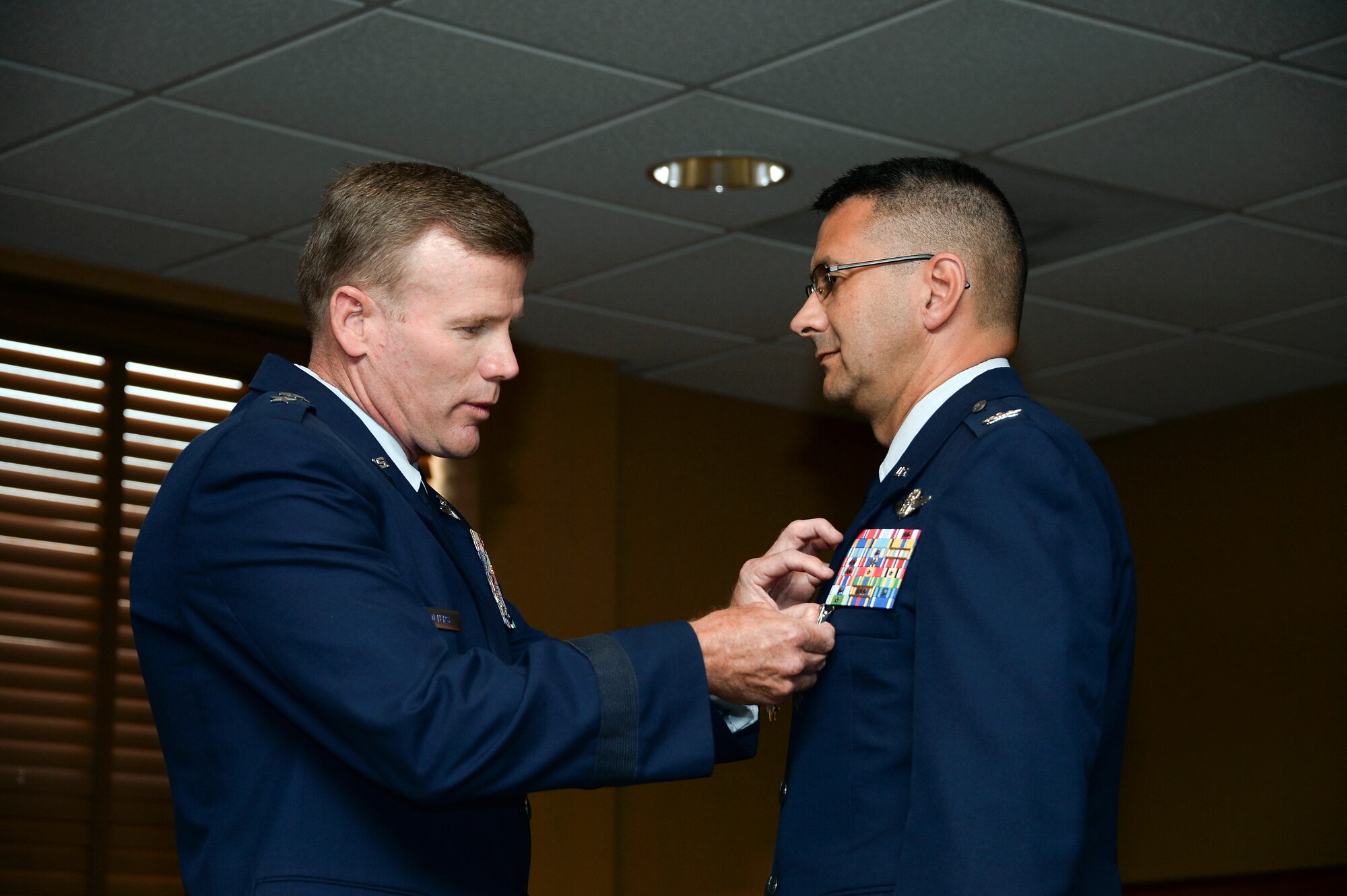 Lt. Gen. Tod Wolters, Commander 12th Air Force (Air Forces Southern) presents Col. Jonathan VanNoord the Legion of Merit during the 612th Theater Operations Group Change of Command Ceremony on Davis-Monthan AFB, Ariz., June 17, 2014.  VanNoord relinquished command of the 612 TOG to Col. James Sheedy. (U.S. Air Force photo by Tech. Sgt. Heather R. Redman/Released)