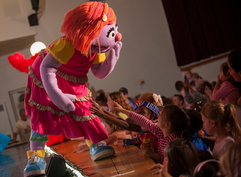 Hundreds of Team Minot family members gathered to watch the Sesame Street USO Experience for Military Families Tour at the Minot Air Force Base theater, June 16-17, 2014. The show, which had four separate viewing times, featured Elmo, Grover, Cookie Monster, Rosita and Katie, who is a military child herself. (U.S. Air Force photo/Airman 1st Class Apryl Hall)