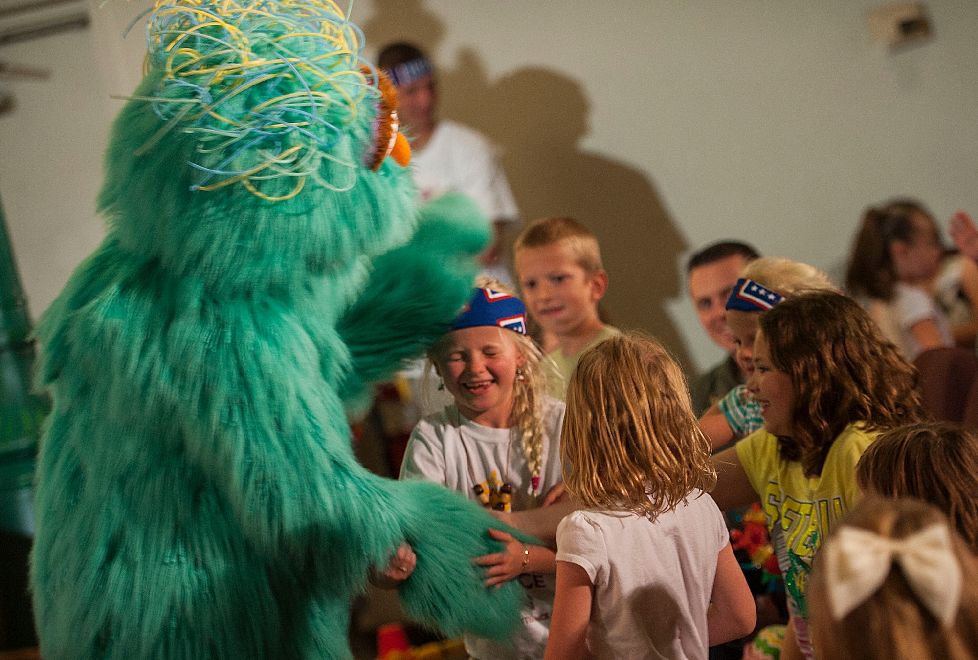 Hundreds of Team Minot family members gathered to watch the Sesame Street USO Experience for Military Families Tour at the Minot Air Force Base theater, June 16-17, 2014. The show, which had four separate viewing times, featured Elmo, Grover, Cookie Monster, Rosita and Katie, who is a military child herself. (U.S. Air Force photo/Airman 1st Class Apryl Hall)