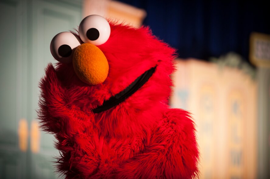 Hundreds of Team Minot family members gathered to watch the Sesame Street USO Experience for Military Families Tour at the Minot Air Force Base theater, June 16-17, 2014. The show, which had four separate viewing times, featured Elmo, Grover, Cookie Monster, Rosita and Katie, who is a military child herself. (U.S. Air Force photo/Airman 1st Class Apryl Hall)