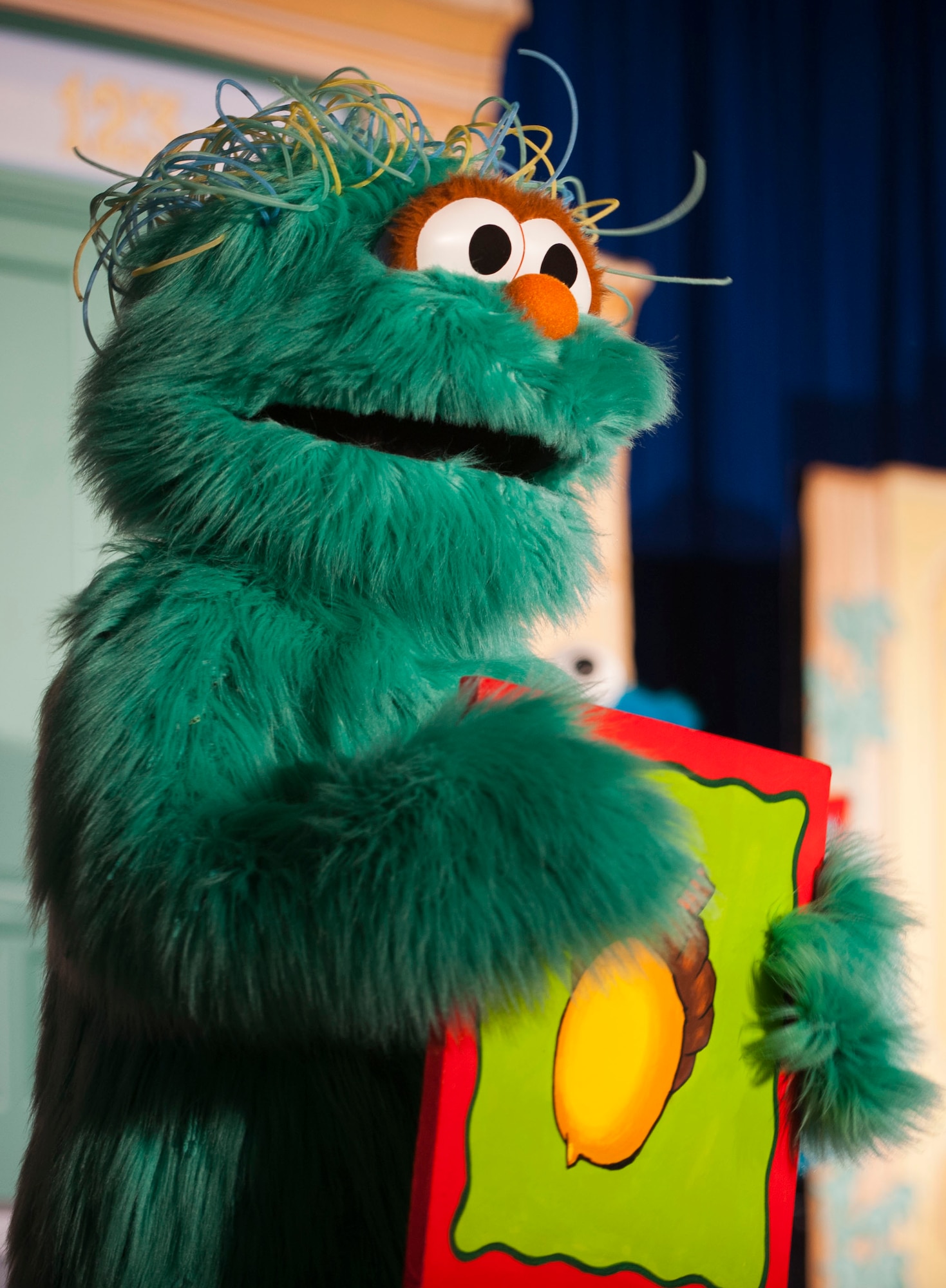 Hundreds of Team Minot family members gathered to watch the Sesame Street USO Experience for Military Families Tour at the Minot Air Force Base theater, June 16-17, 2014. The show, which had four separate viewing times, featured Elmo, Grover, Cookie Monster, Rosita and Katie, who is a military child herself. (U.S. Air Force photo/Airman 1st Class Apryl Hall)