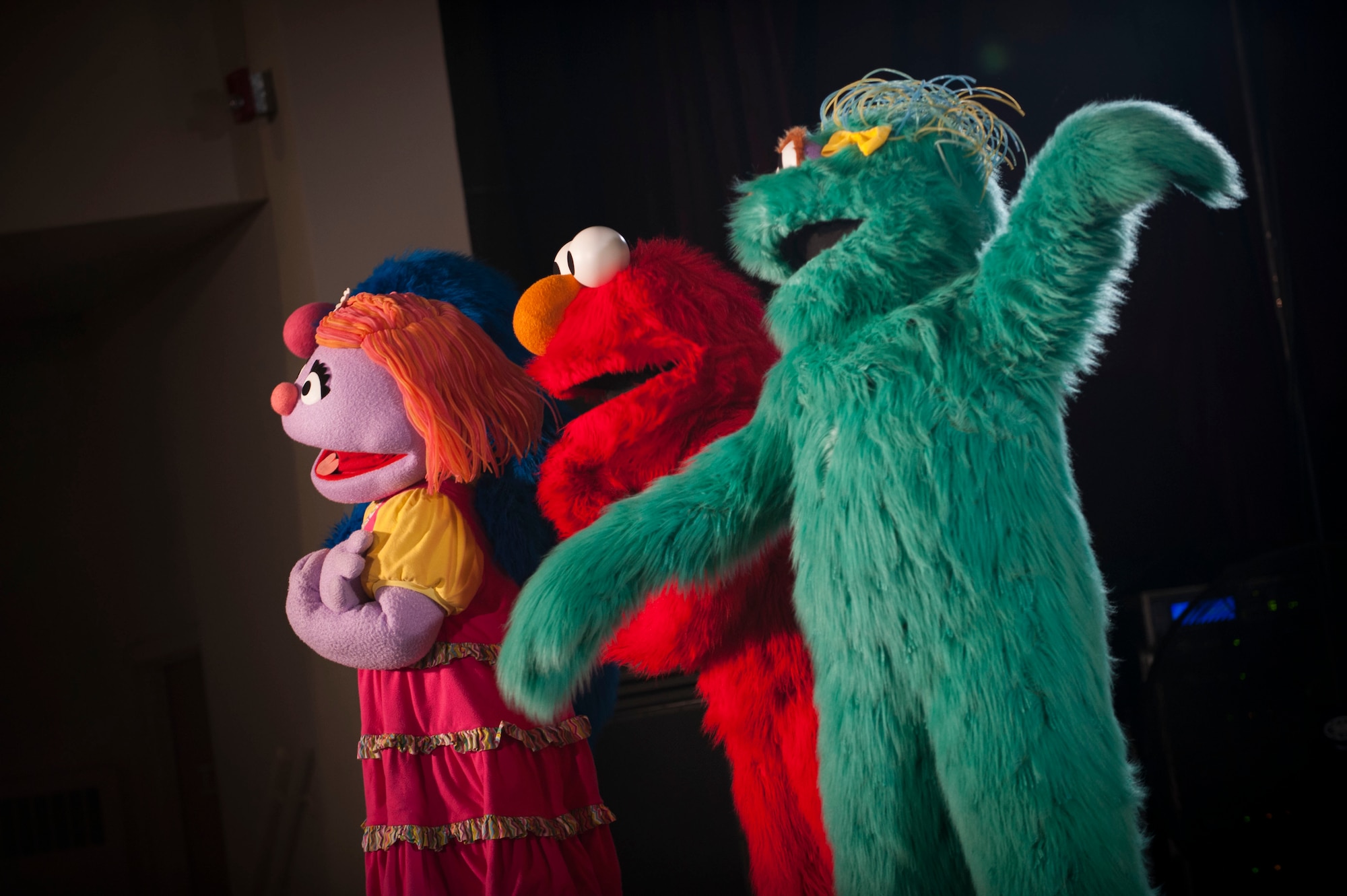 Hundreds of Team Minot family members gathered to watch the Sesame Street USO Experience for Military Families Tour at the Minot Air Force Base theater, June 16-17, 2014. The show, which had four separate viewing times, featured Elmo, Grover, Cookie Monster, Rosita and Katie, who is a military child herself. (U.S. Air Force photo/Airman 1st Class Apryl Hall)