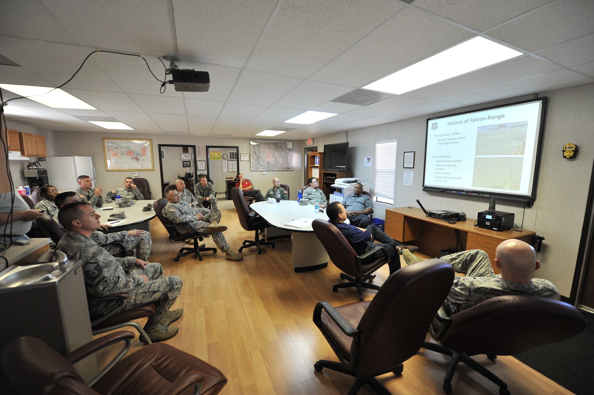 FORT SILL, Okla. – U.S. Army Soldiers from the Fort Sill Office of the Inspector General and U.S. Air Force Airmen from the 97th Air Mobility Wing IG talk with one another during a joint IG training day at Falcon Range on Fort Sill June 11, 2014. The training gave IG members a chance to exchange professional skills and experience. (U.S. Air Force photo by Senior Airman Dillon Davis/Released)