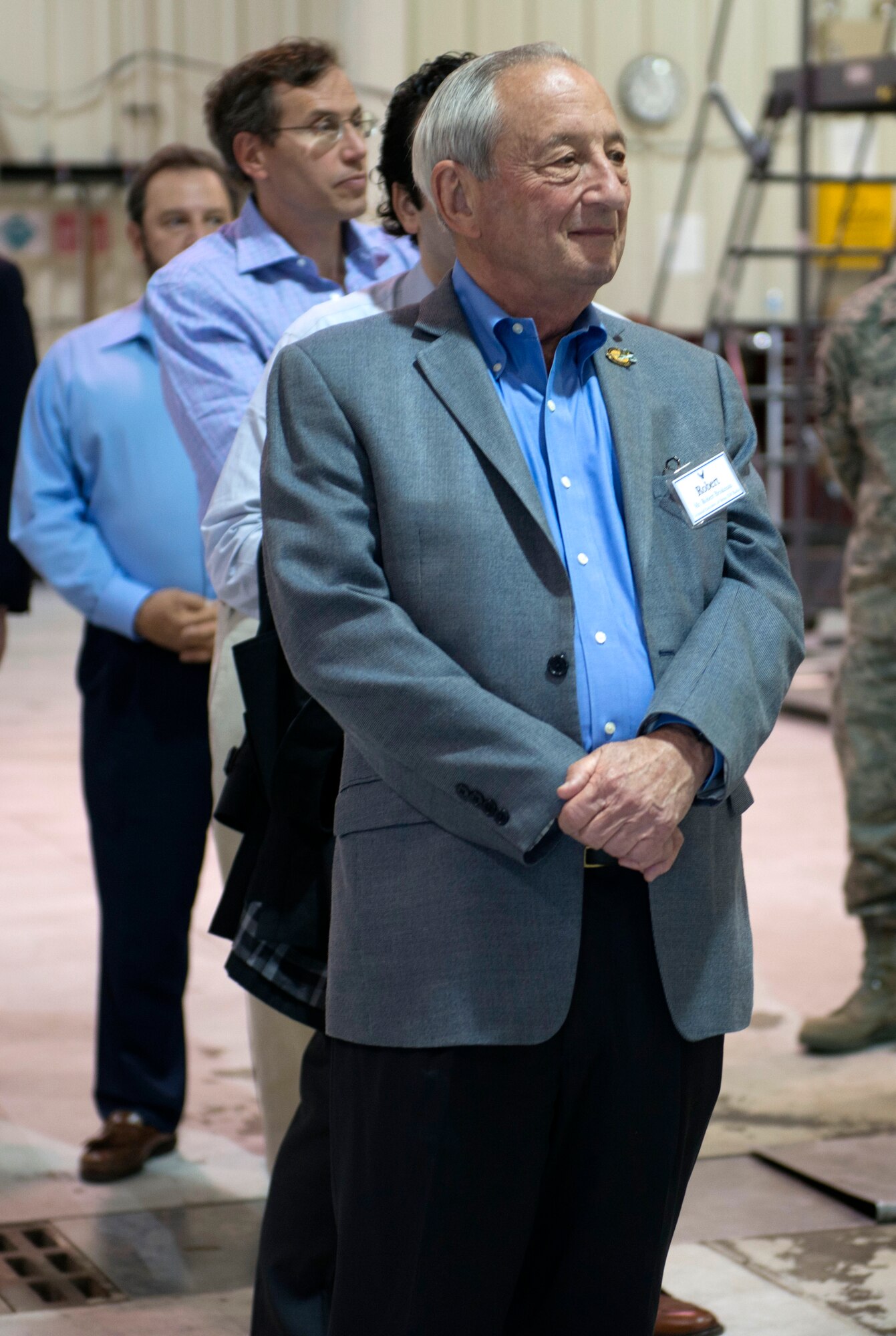 A member of the Business Executives for National Security listens to a briefing at Minot Air Force Base, N.D., June 10, 2014. Airmen from the 54th Helicopter Squadron gave a tour of the facility and explained the purpose and capabilities of the UH-N1 Huey.  (U.S. Air Force photos/Airman 1st Class Sahara L. Fales)