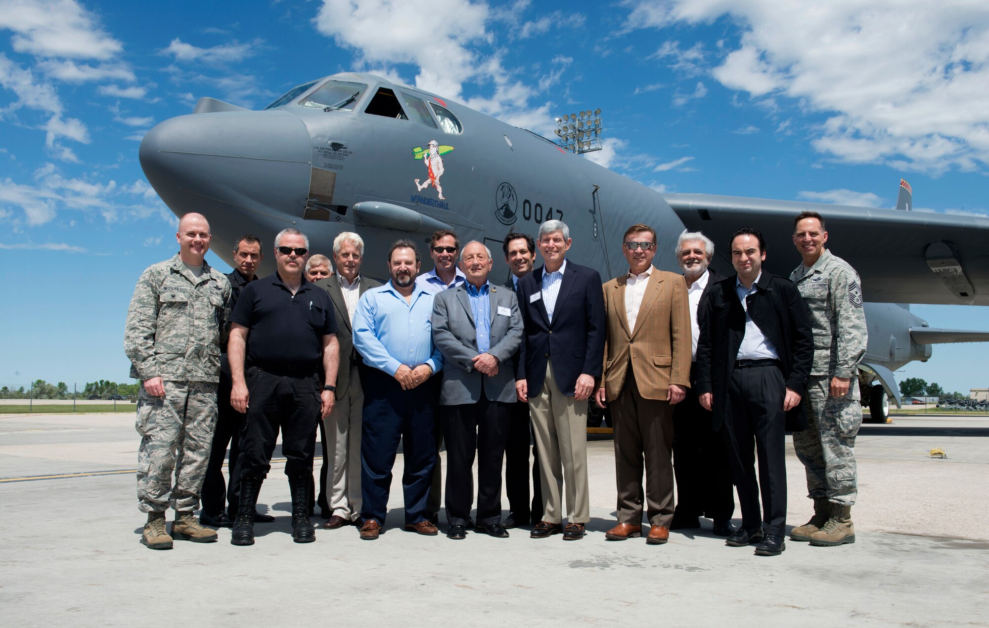 Members of the Business Executives for National Security pose with 5th bomb wing leadership in front of a B-52 Stratofortress at Minot Air Force Base, N.D., June 10, 2014. The BENS members toured different facilities on base in hopes of fostering the spirit of innovation, while maintaining the importance of strategic deterrence. (U.S. Air Force photos/Airman 1st Class Sahara L. Fales)
