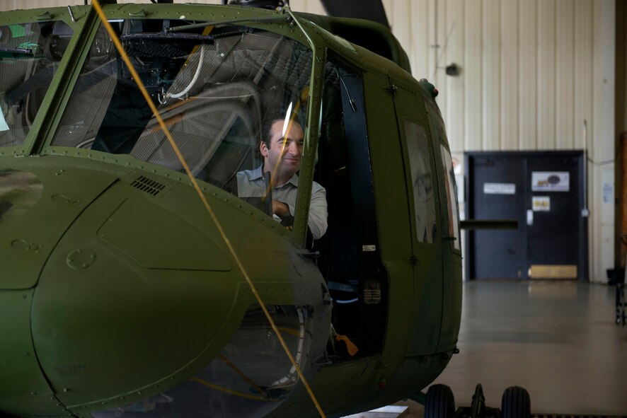 A member of the Business Executives for National Security sits in a UH-1N Huey at Minot Air Force Base, N.D., June 10, 2014. The BENS members toured different facilities on base in hopes of fostering the spirit of innovation, while maintaining the importance of strategic deterrence. (U.S. Air Force photo/Airman 1st Class Sahara L. Fales)