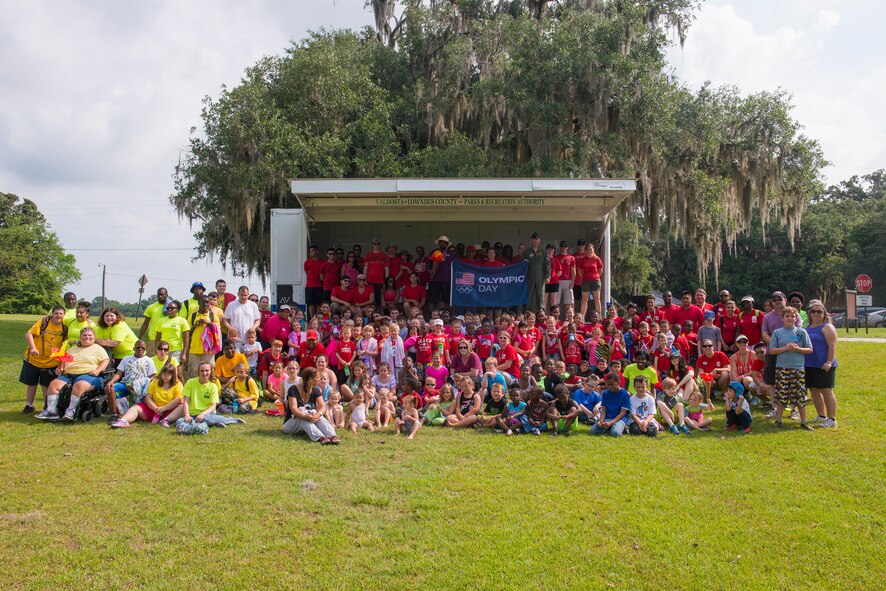 Participants and volunteers pose for a group photo at Moody’s Olympic Day celebration at Grassy Pond in Lake Park, Ga., June 13, 2014. (U.S. Air Force photo by Airman 1st Class Ryan Callaghan/Released)
