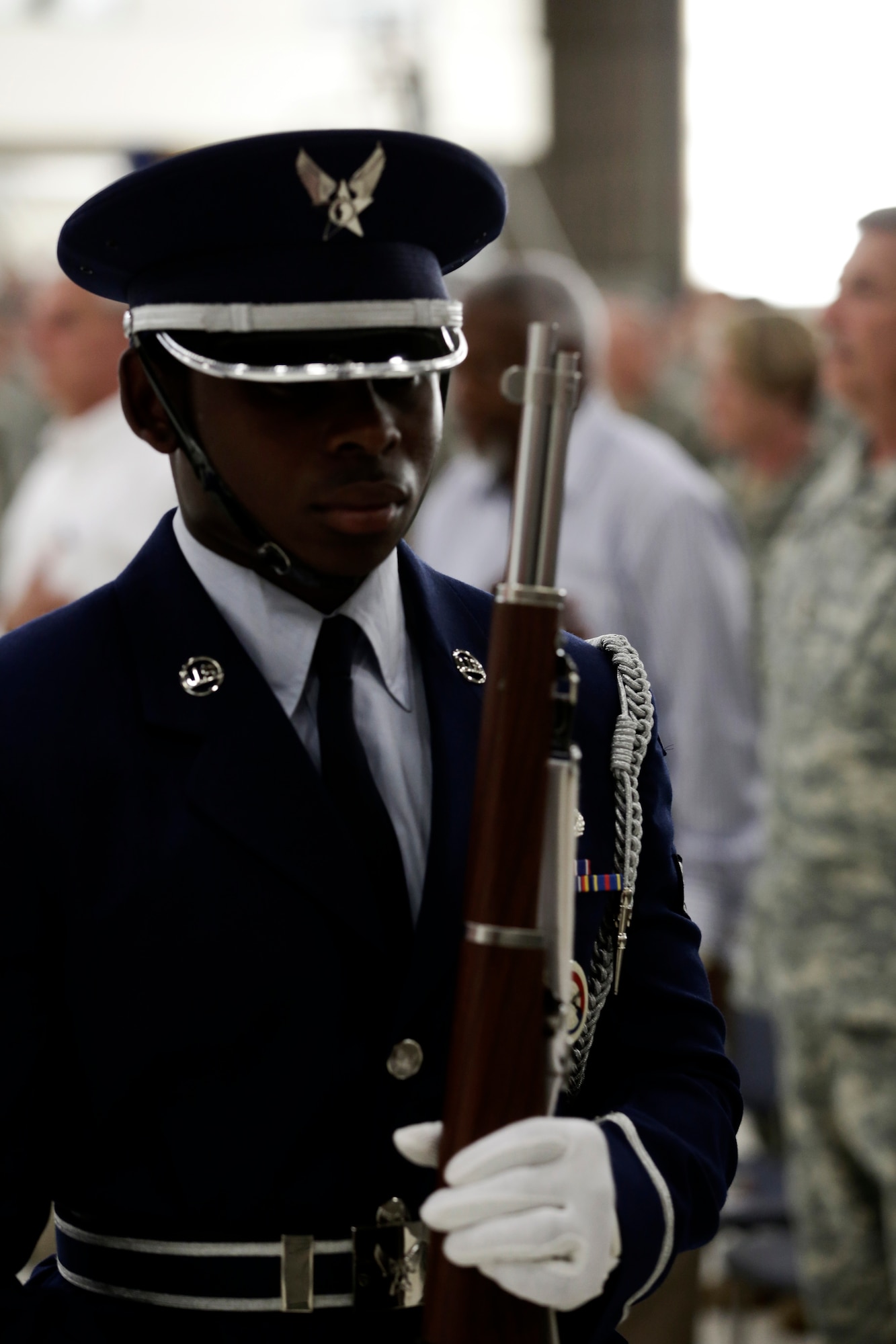 Senior Airman Richard Green, 188th Wing Honor Guard, performs during a Conversion Day ceremony held at Ebbing Air National Guard Base, Fort Smith, Arkansas, June 7, 2014. The ceremony was to recognize the many changes occurring at the wing as a result of its conversion to a remotely piloted aircraft (MQ-9 Reapers) and intelligence, surveillance and reconnaissance mission. The 188th Fighter Wing was redesignated as the 188th Wing during the event. (U.S. Air National Guard photo by Master Sgt. Mark Moore)