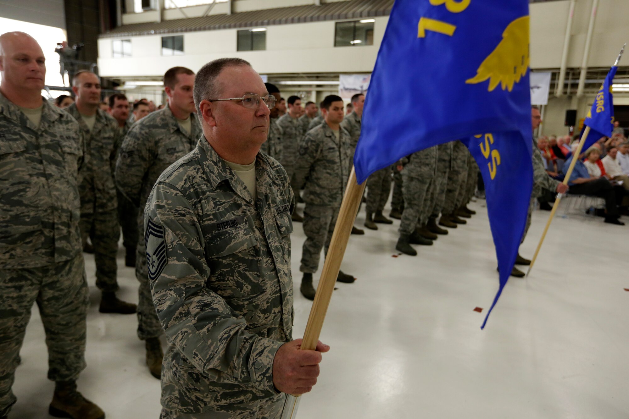 Chief Master Sgt. Kirby Sterling holds the 288th Operations Support Squadron guidon during a Conversion Day ceremony at Ebbing Air National Guard Base, Fort Smith, Arkansas, June 7, 2014. The ceremony recognized the many changes occurring at the wing as a result of its conversion to a remotely piloted aircraft (MQ-9 Reapers) and intelligence, surveillance and reconnaissance mission. (U.S. Air National Guard photo by Master Sgt. Mark Moore)