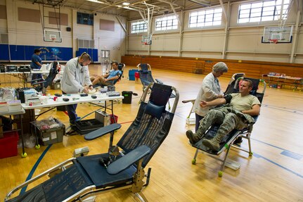 Members of Joint Base Charleston donate blood at the Base Gym, June 12, 2014, at JB Charleston, S.C. Members of JB Charleston had the opportunity to donate blood with the help of the American Red Cross, which utilizes volunteers to aid those in need during emergency situations. (U.S. Air Force photo/Senior Airman George Goslin)