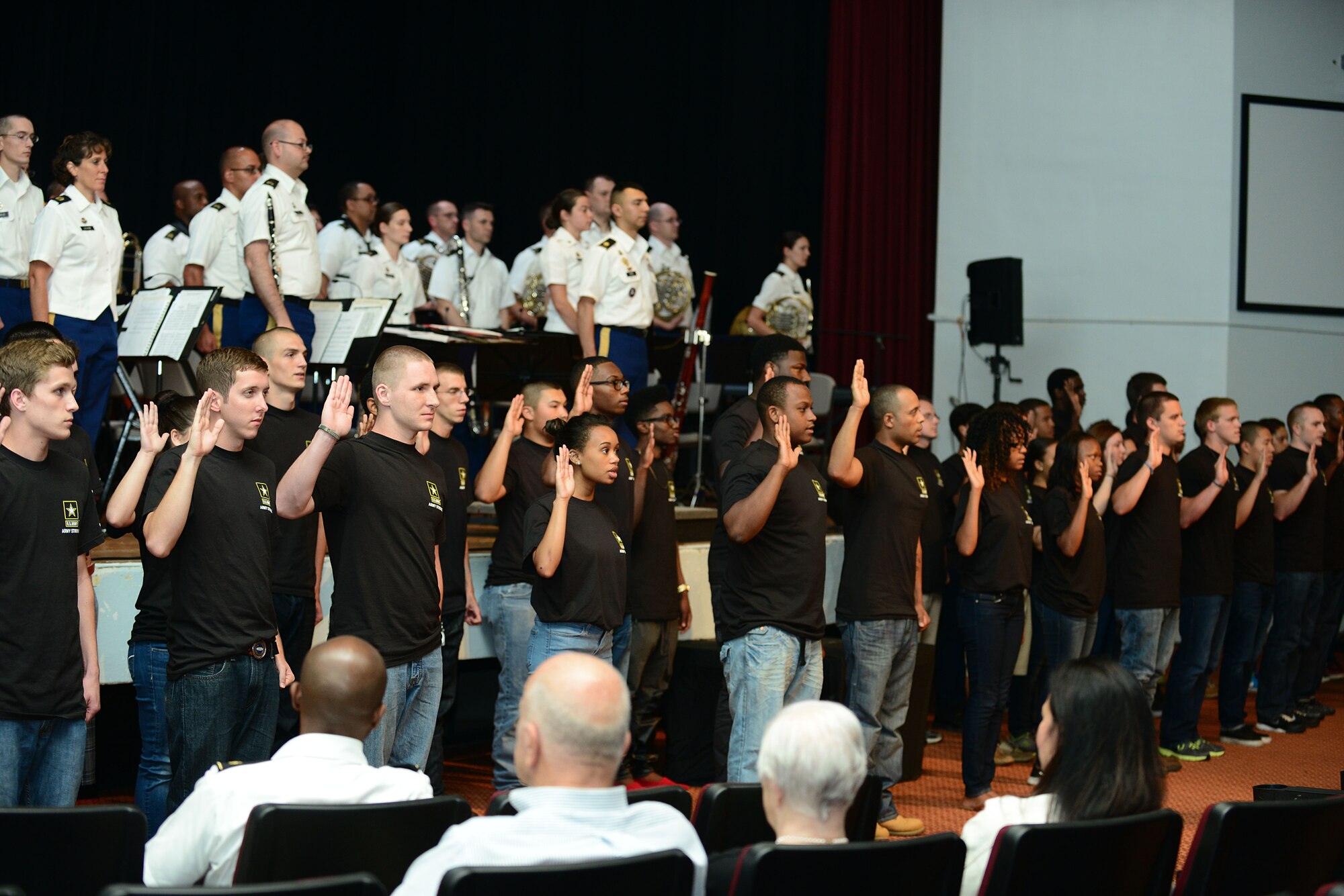 More than 40 members of the U.S. Army Delayed Entry Program recite the Oath of Enlistment during the 239th Army Birthday concert and streamer ceremony at Fort Eustis, Va., June 12, 2014. The recruits were sworn in by U.S. Army Lt. Gen. Kevin Mangum, TRADOC deputy commanding general and chief of staff.  (U.S. Air Force photo by Airman 1st Class Kimberly Nagle/Released)