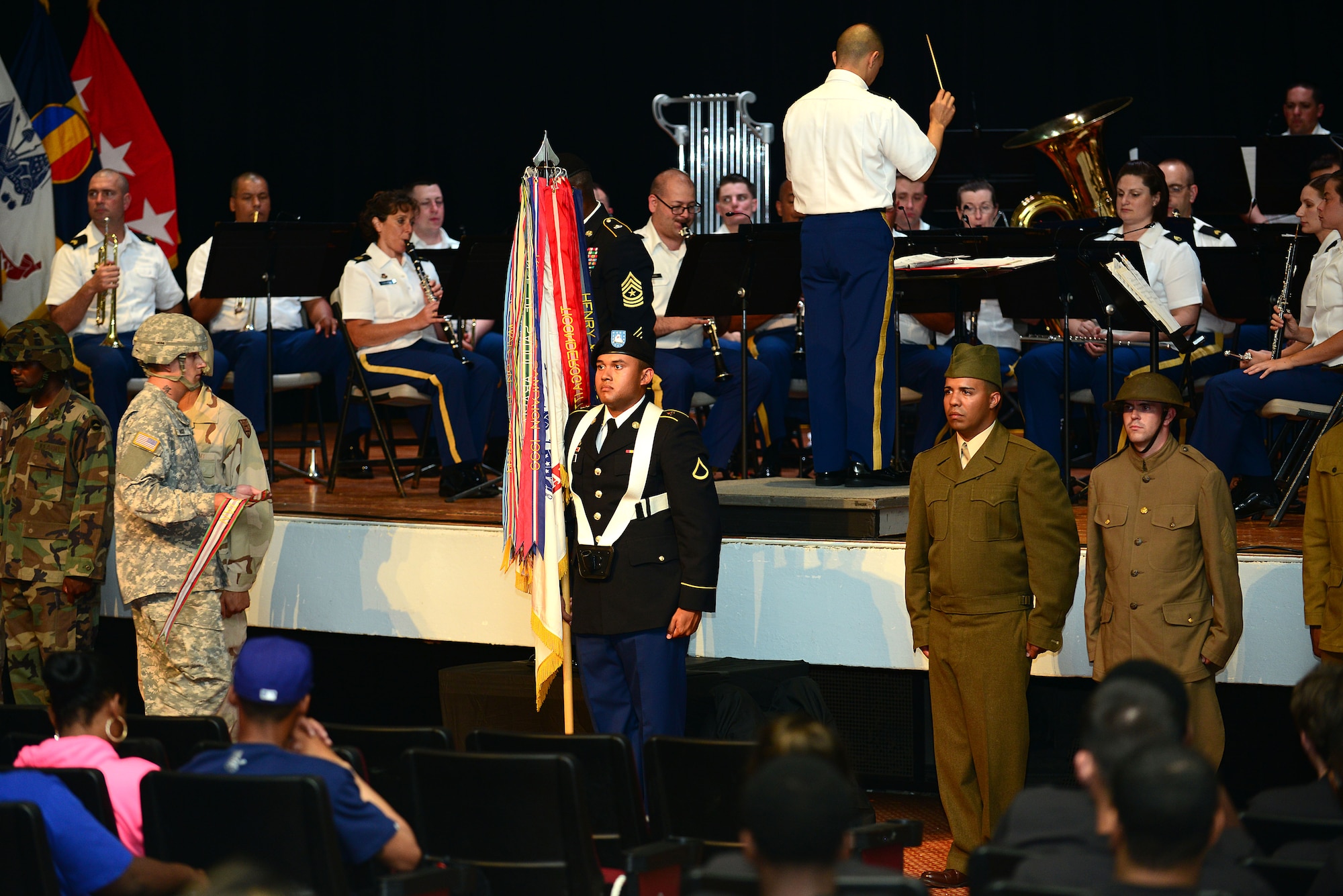 U.S. Army Soldiers take part in the 239th Army Birthday concert and streamer ceremony at Fort Eustis, Va., June 12, 2014. During the streamer ceremony Soldiers from the 7th Transportation Brigade (Expeditionary) dressed in period uniforms spanning from the Revolutionary War to current combat attire. (U.S. Air Force photo by Airman 1st Class Kimberly Nagle/Released)