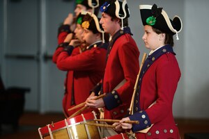 Members of the Fifes and Drums of Yorktown perform during the 239th Army Birthday concert and streamer ceremony at Fort Eustis, Va., June 12, 2014. By the end of the steamer ceremony, 189 streamers hung on the Army flag, each representing a campaign that the Army took part in. (U.S. Air Force photo by Airman 1st Class Kimberly Nagle/Released)